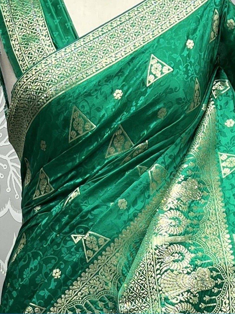 Emerald green velvet saree with gold floral and geometric embroidery, perfect for ethnic occasions