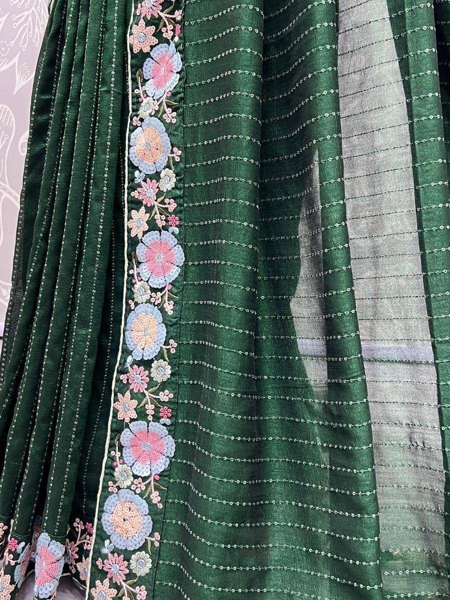 Green ethnic gown with floral embroidery and sequin detailing, perfect for Indian festive wear.