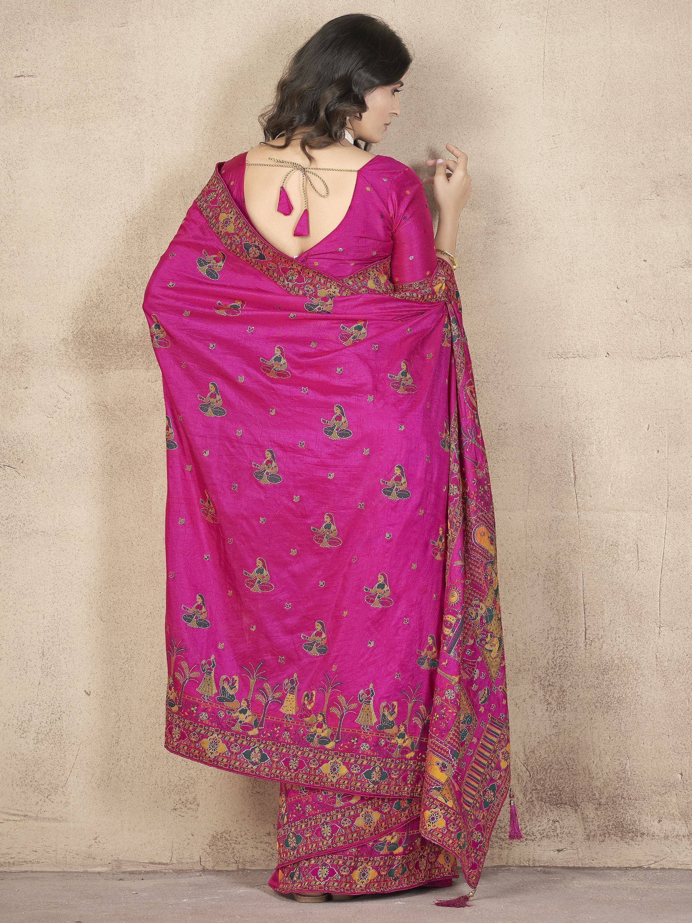 Vibrant pink ethnic saree with traditional printed motifs and back tie blouse, perfect for festive occasions.