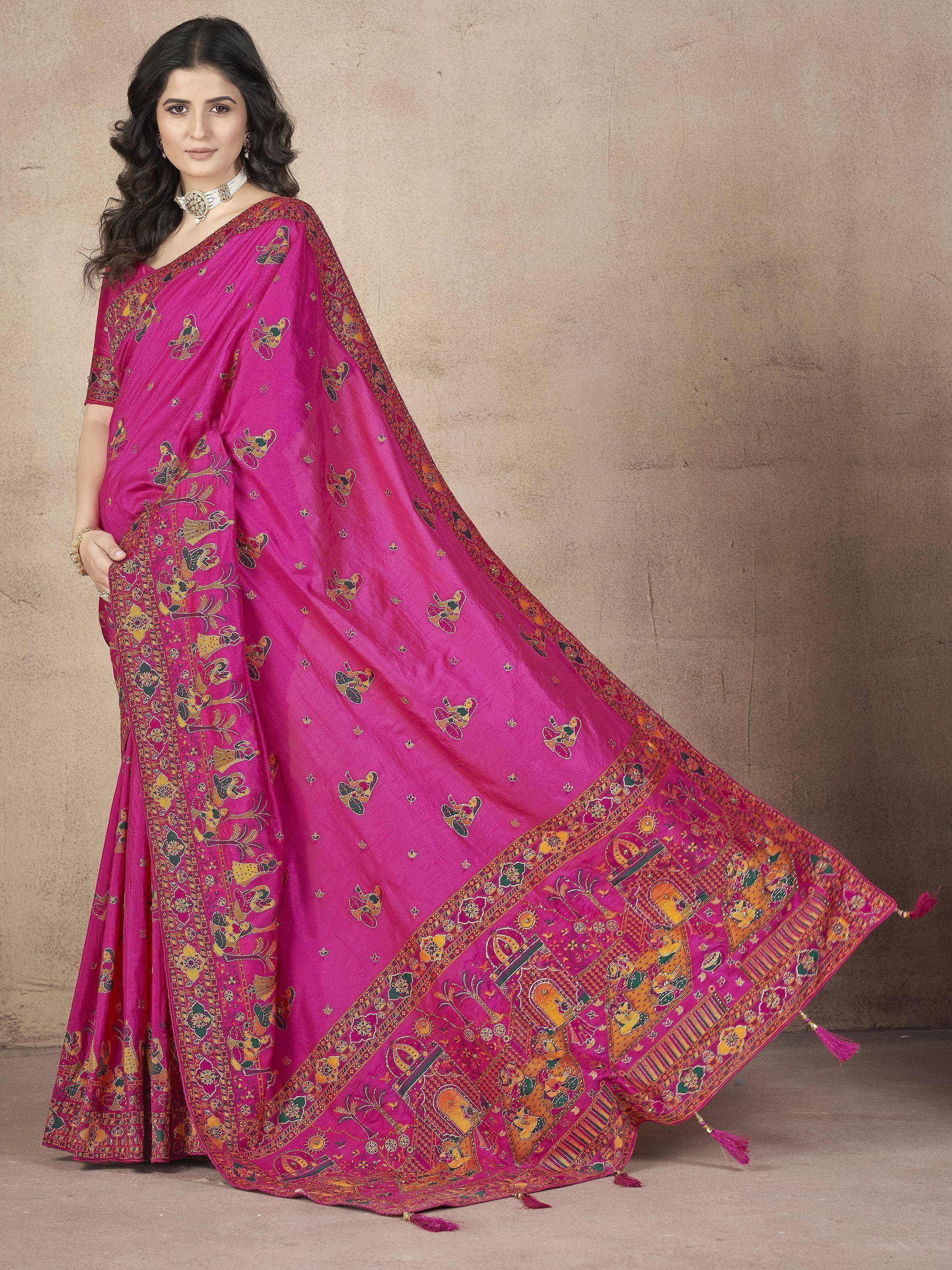 Vibrant pink saree with intricate folk art print, perfect for Indian ethnic wear occasions