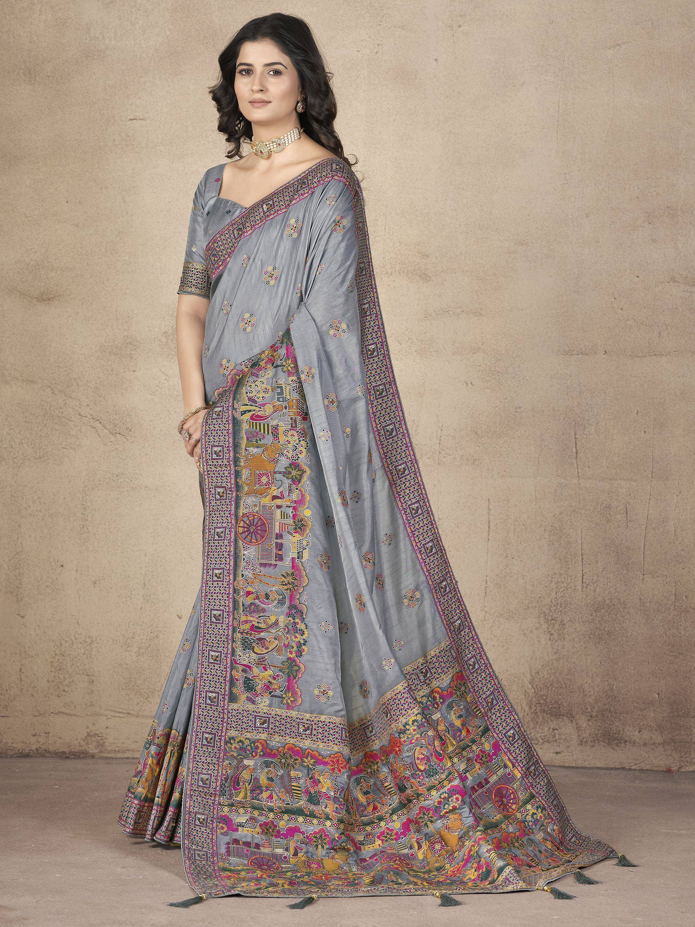 Grey printed saree with intricate border and traditional motifs, perfect for ethnic occasions