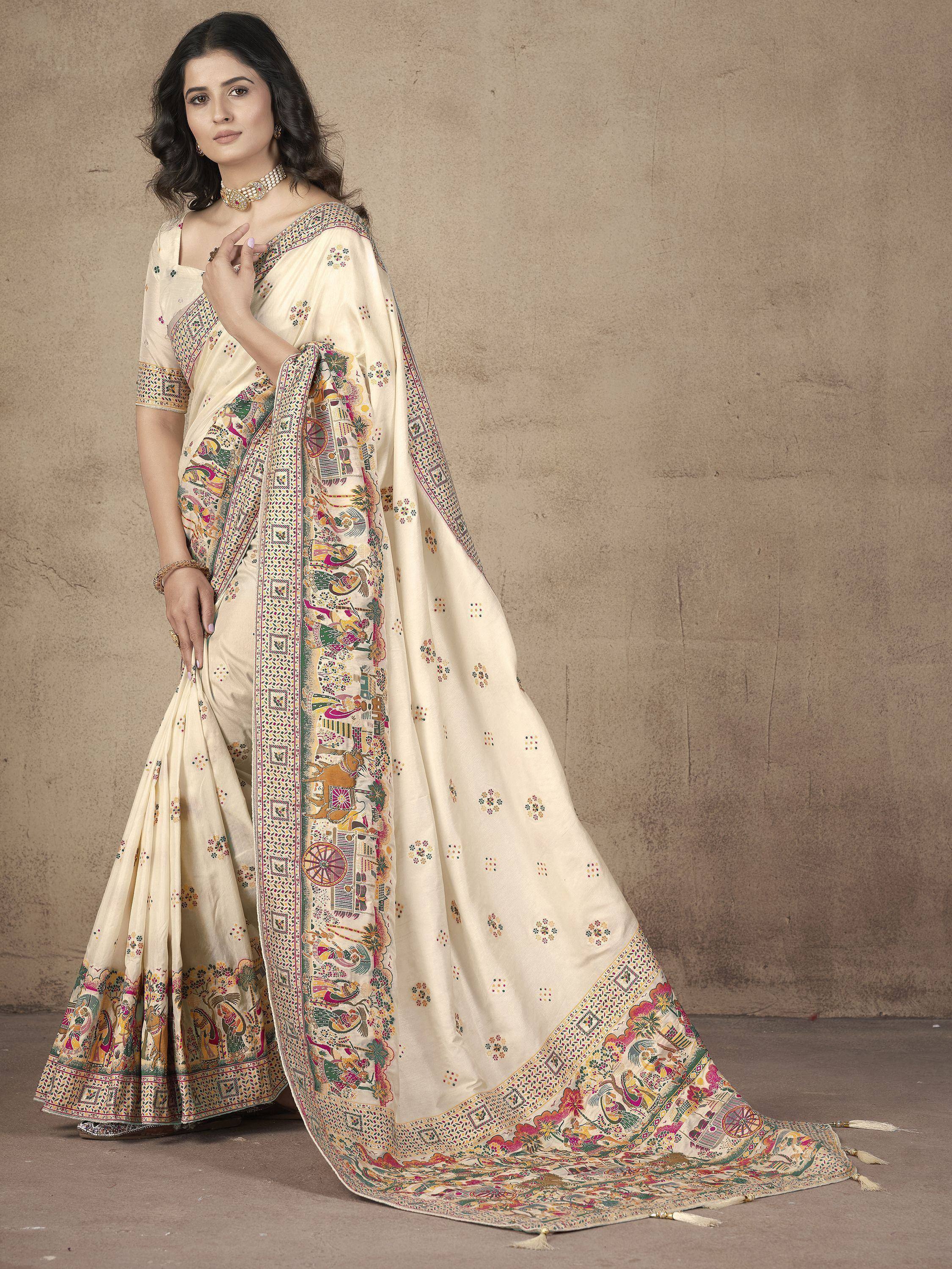 Cream ethnic saree with colorful folk art print, perfect for Indian occasions and festivals