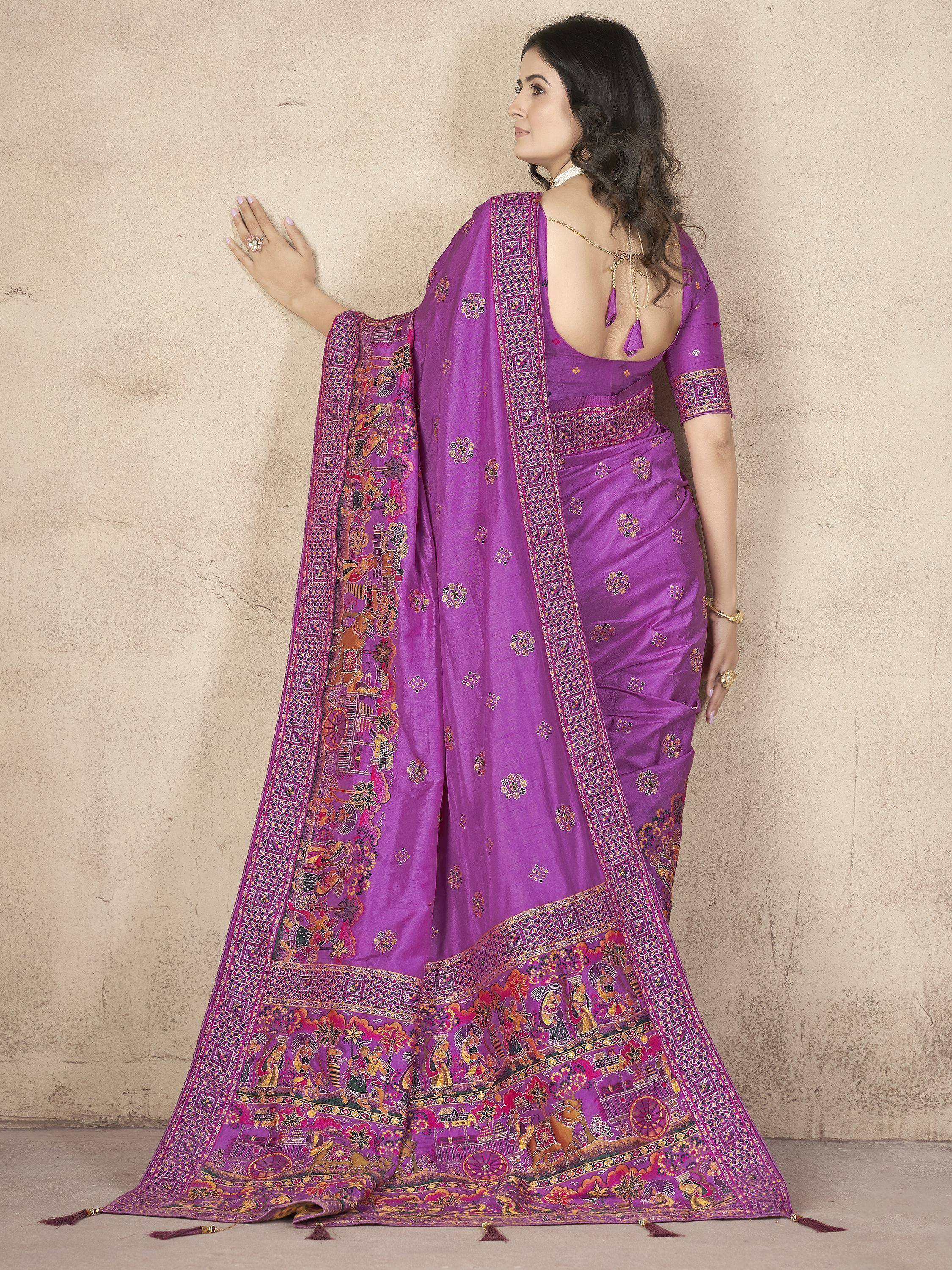 Purple designer saree with intricate embroidery and traditional motifs, perfect for ethnic occasions