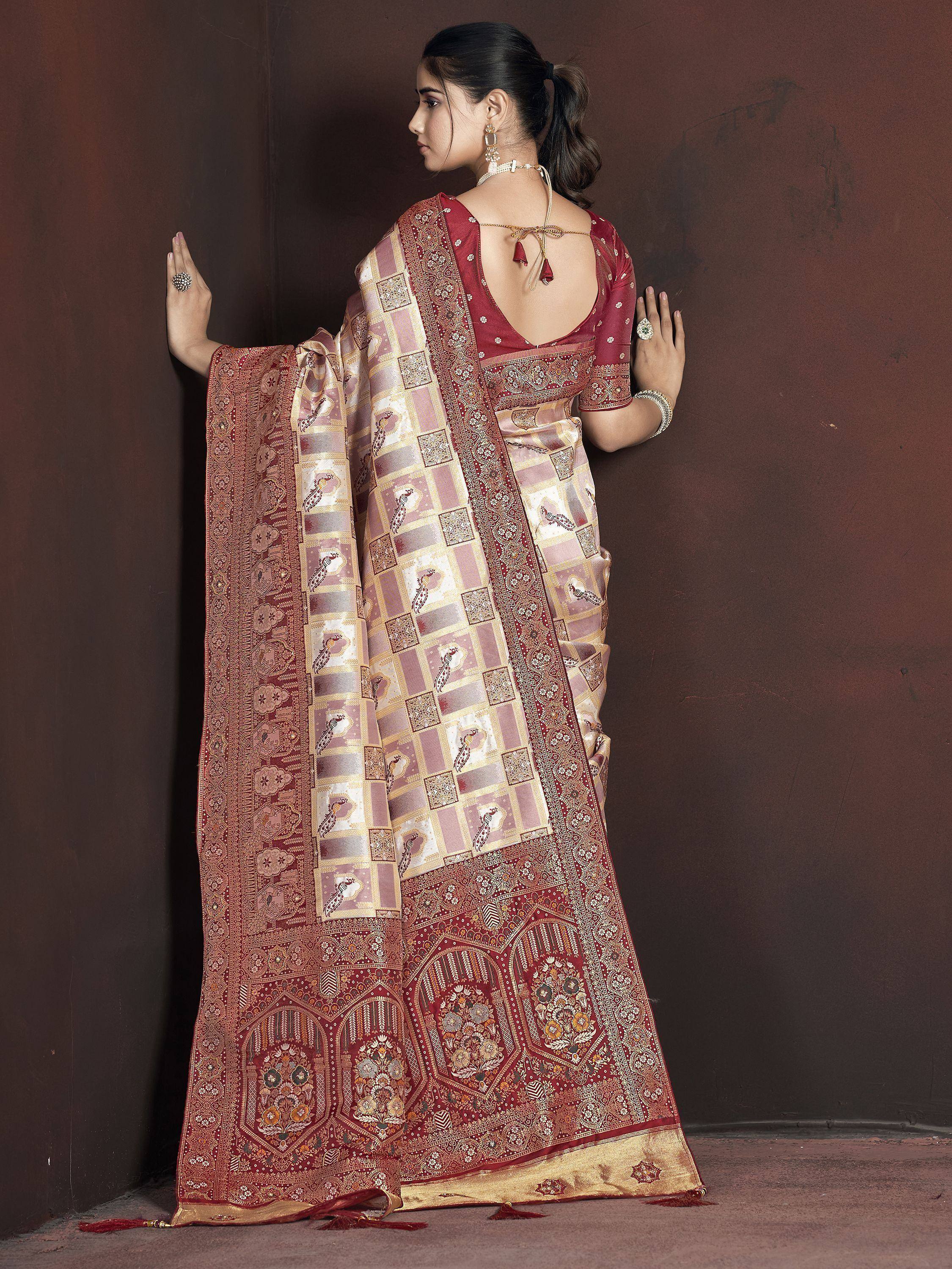 Elegant maroon and gold designer saree with peacock motifs and intricate border, perfect for Indian ethnic wear