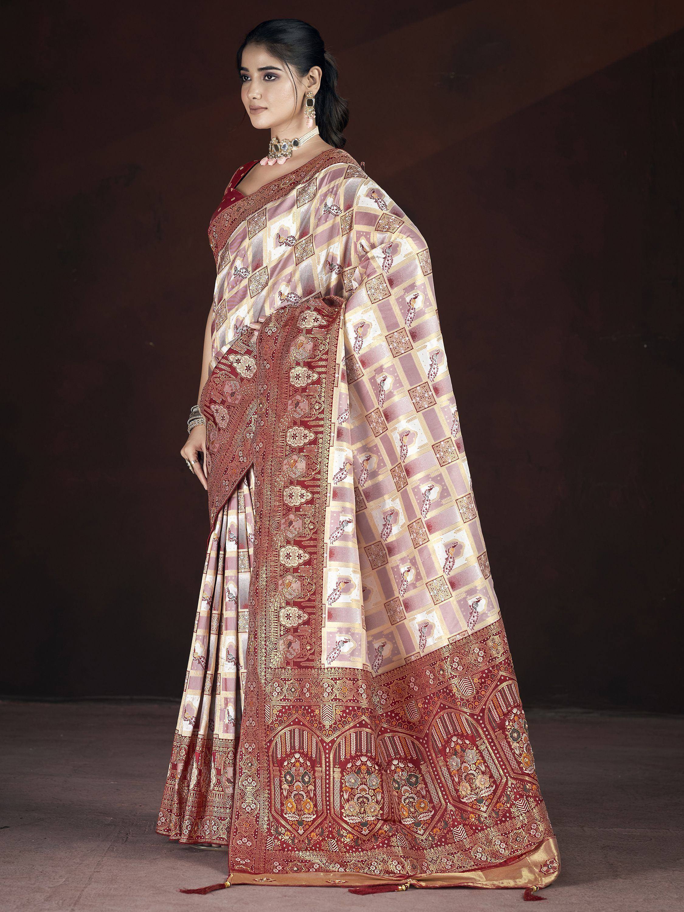Elegant maroon and cream designer saree with peacock motifs and intricate gold border, perfect for Indian ethnic occasions.