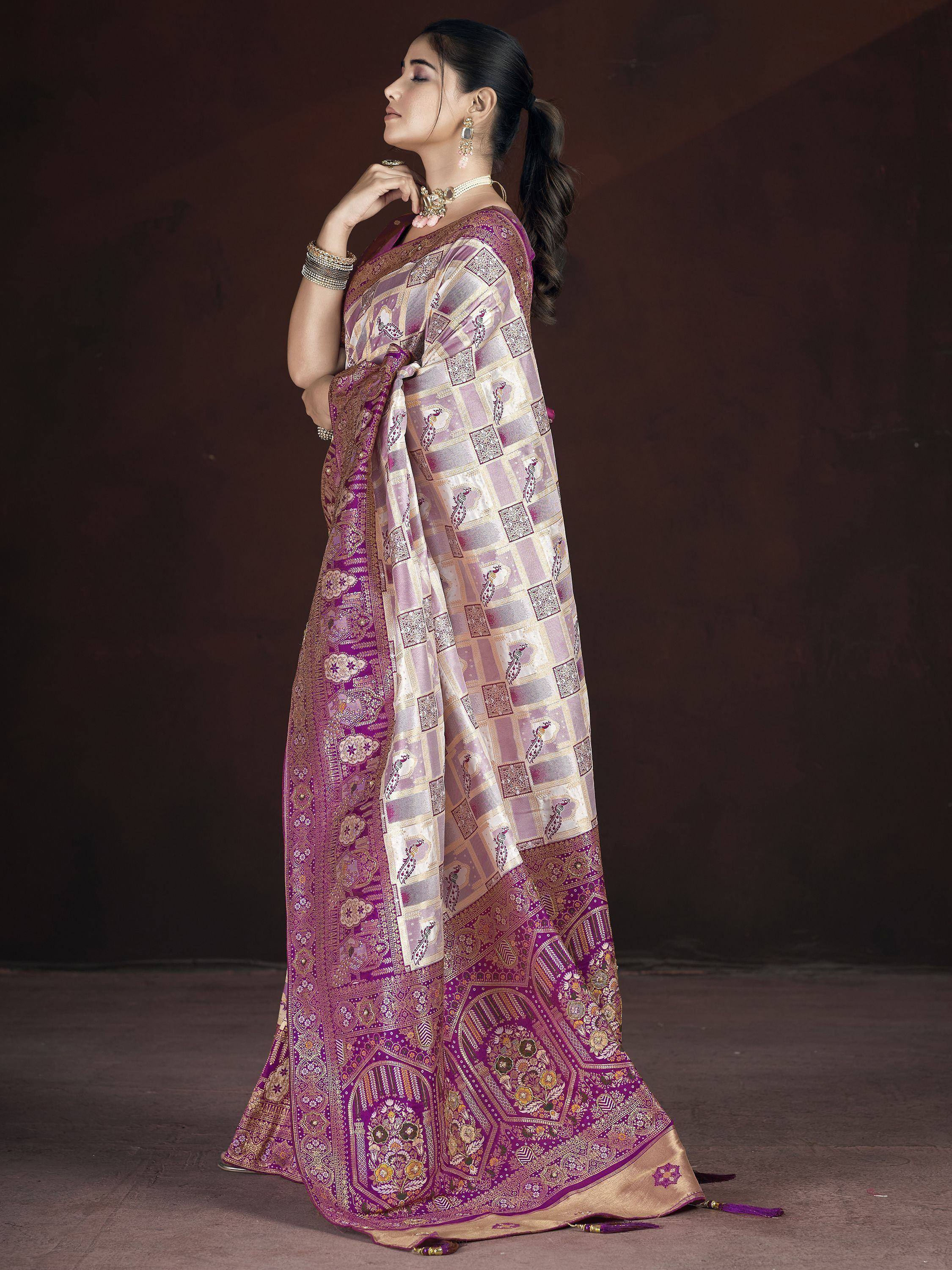 Purple and gold designer saree with peacock motifs and intricate border, perfect for Indian ethnic wear