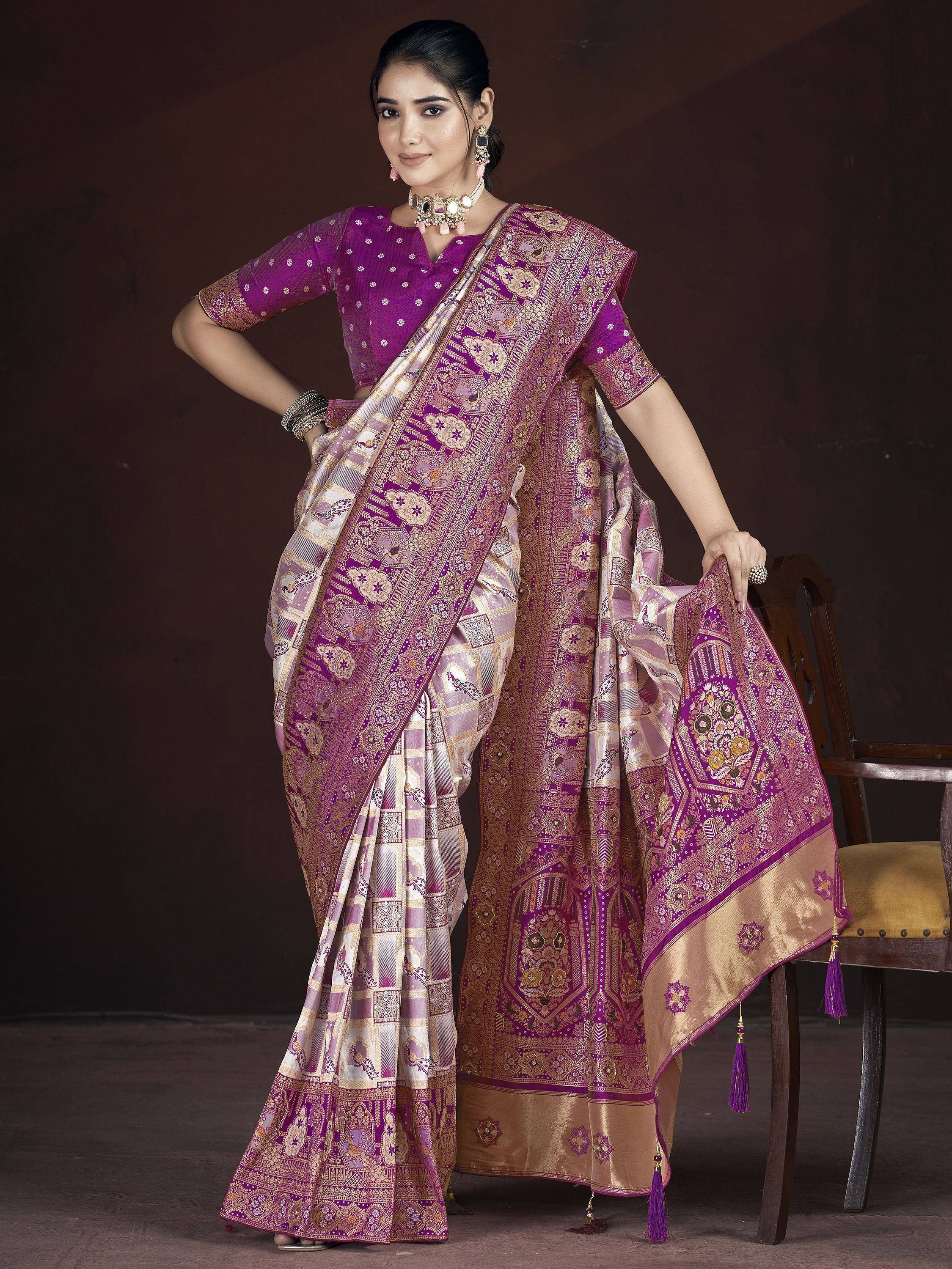 Purple and gold designer saree with intricate embroidery and tassels, perfect for Indian ethnic wear