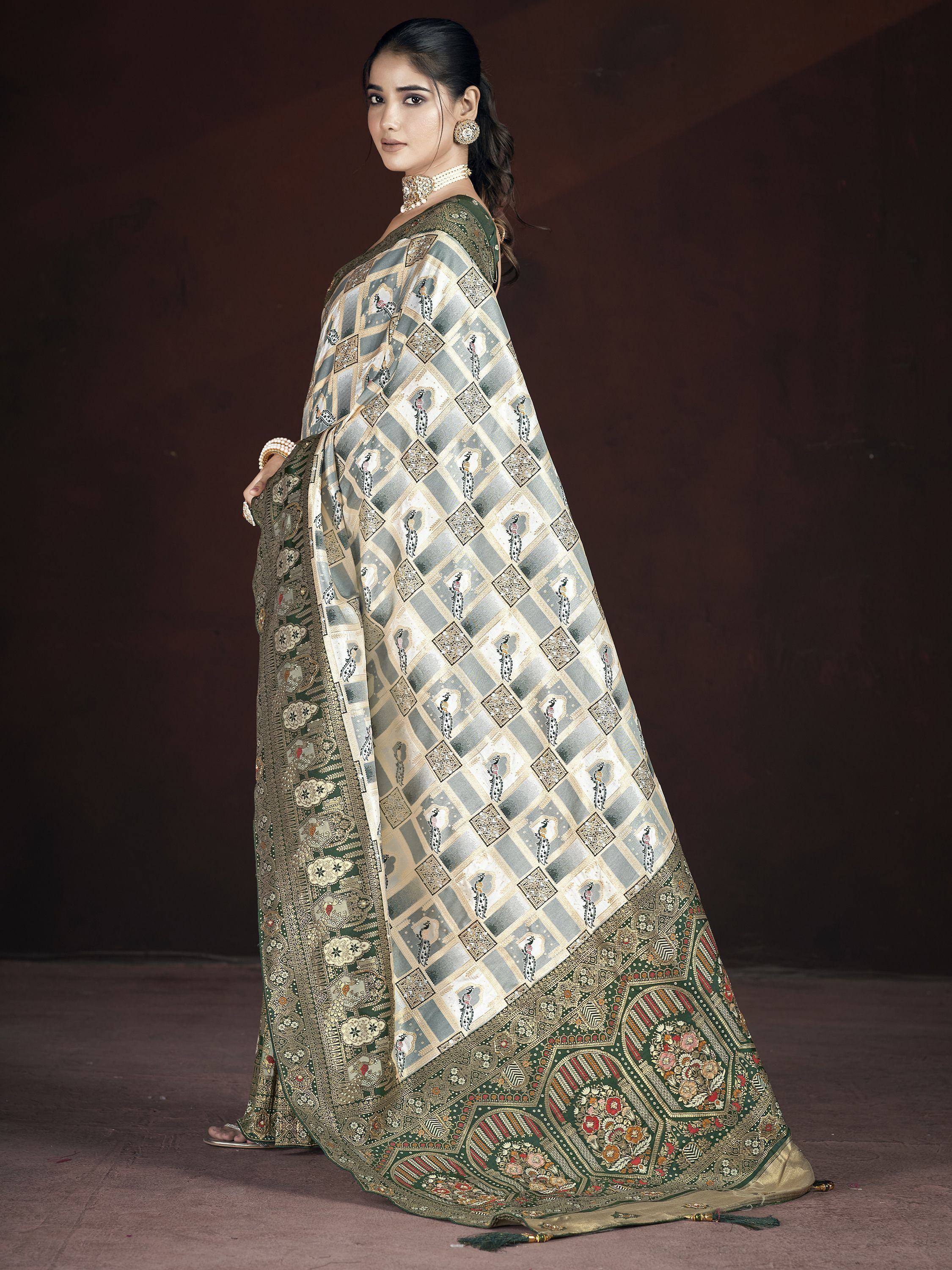 Elegant green and gold saree with peacock print and intricate border, perfect for Indian ethnic occasions