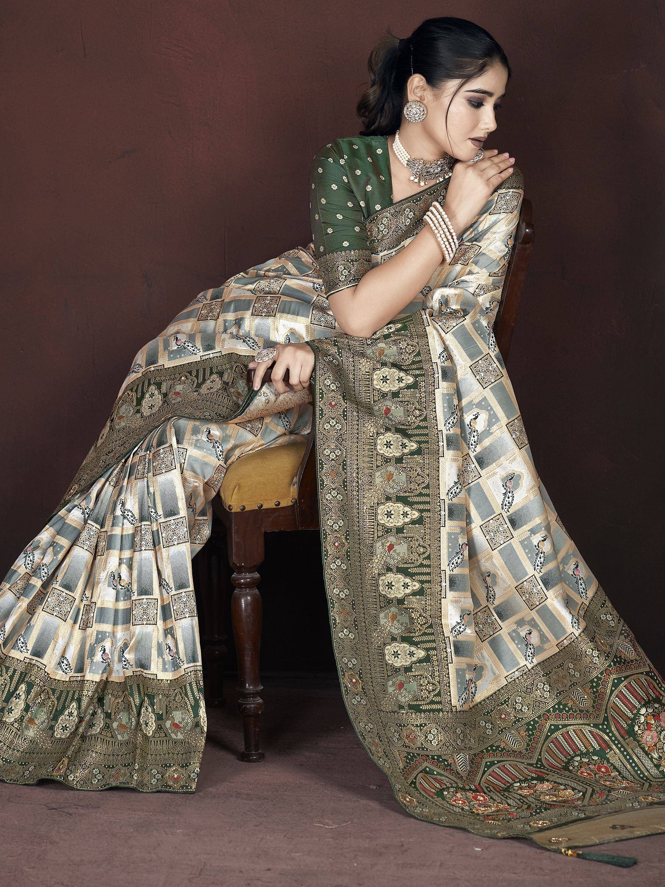 Elegant green and gold ethnic saree with peacock print, perfect for Indian weddings and festivals