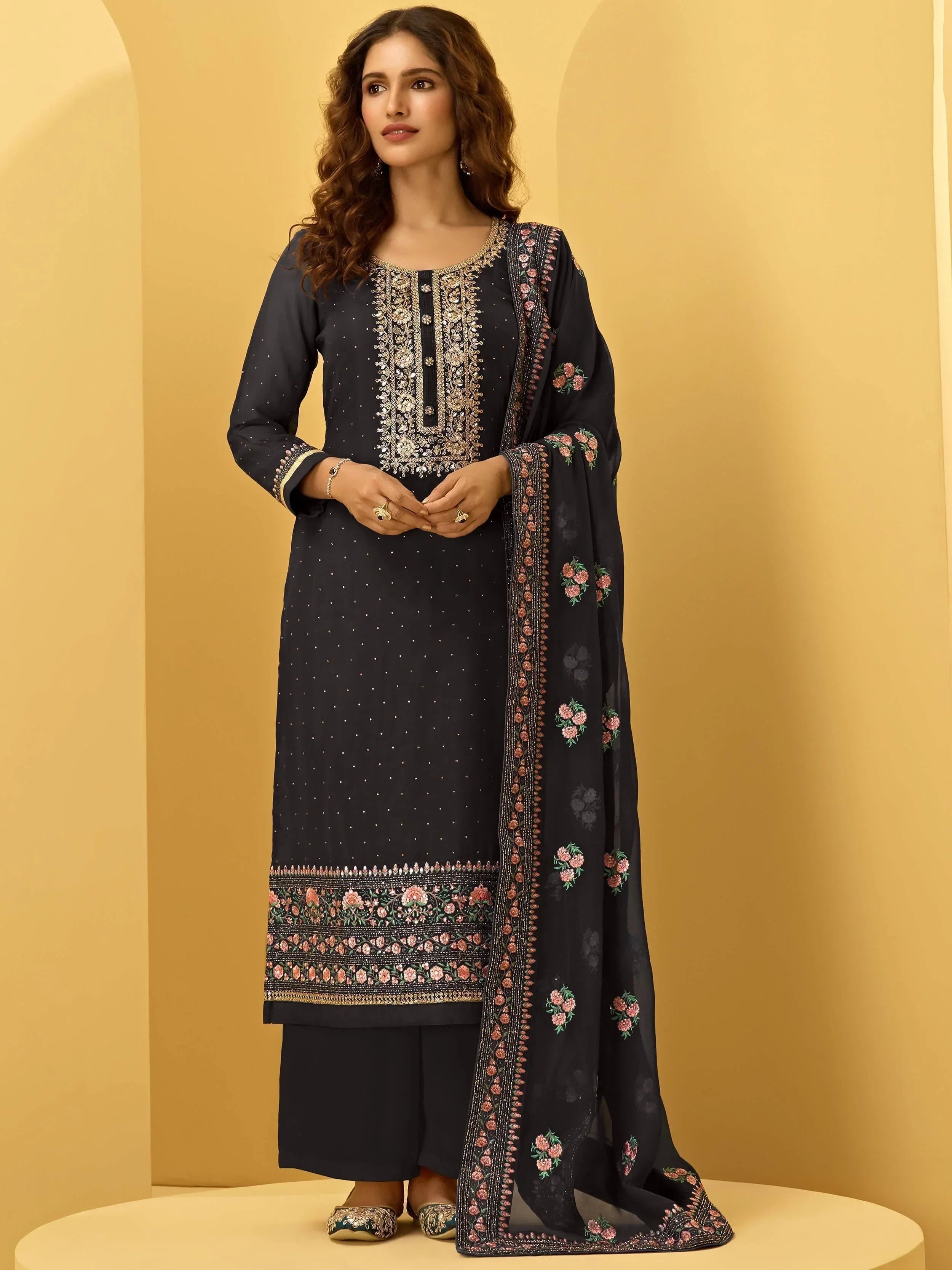Woman wearing black embroidered straight salwar kameez with dupatta, traditional ethnic wear