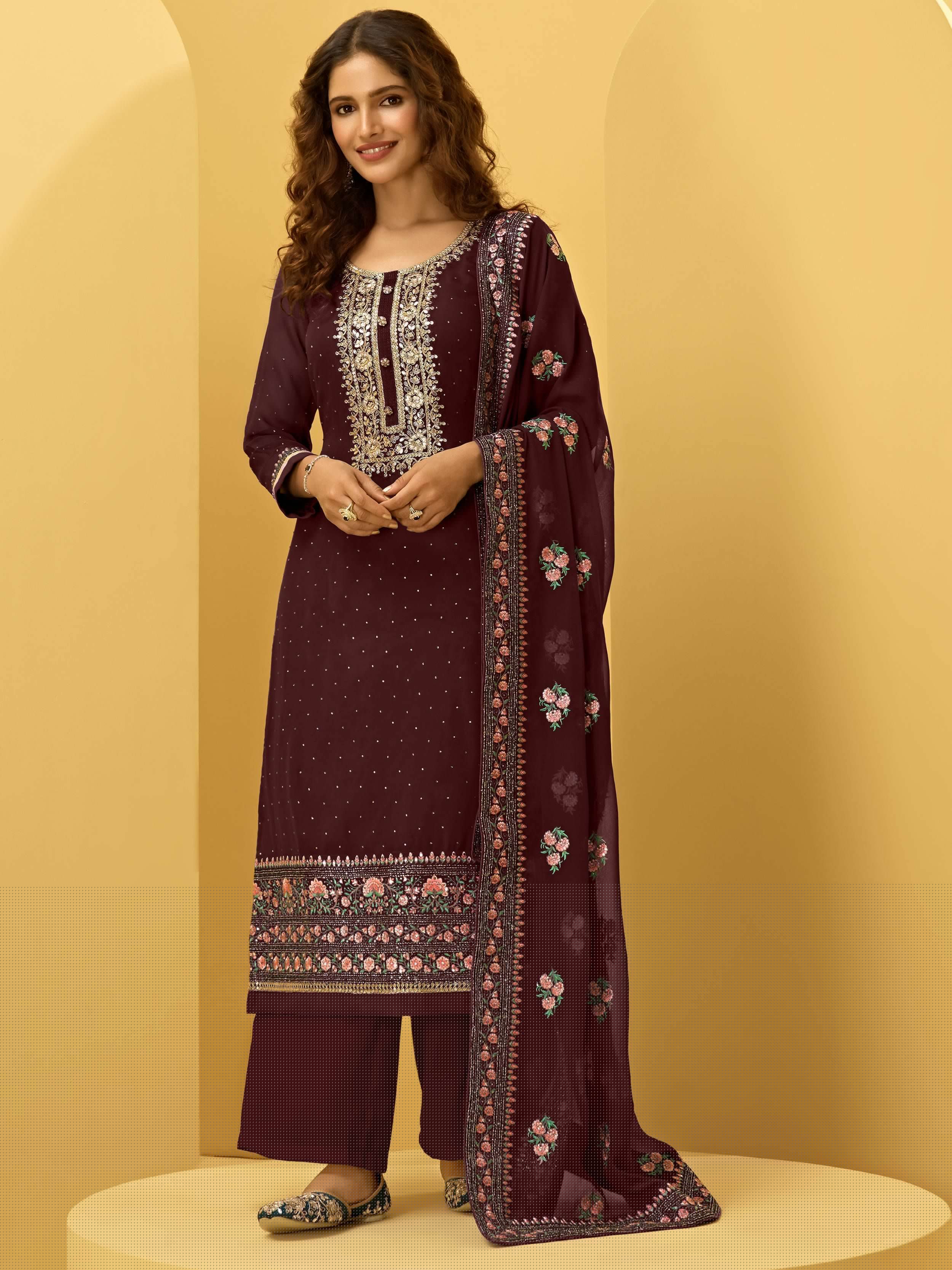 Woman wearing maroon embroidered salwar kameez with floral dupatta, ethnic wear fashion