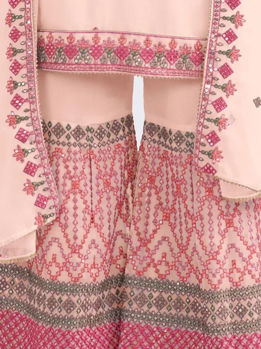 Pink embroidered lehenga choli with intricate floral and geometric mirror work, perfect for Indian ethnic wear.