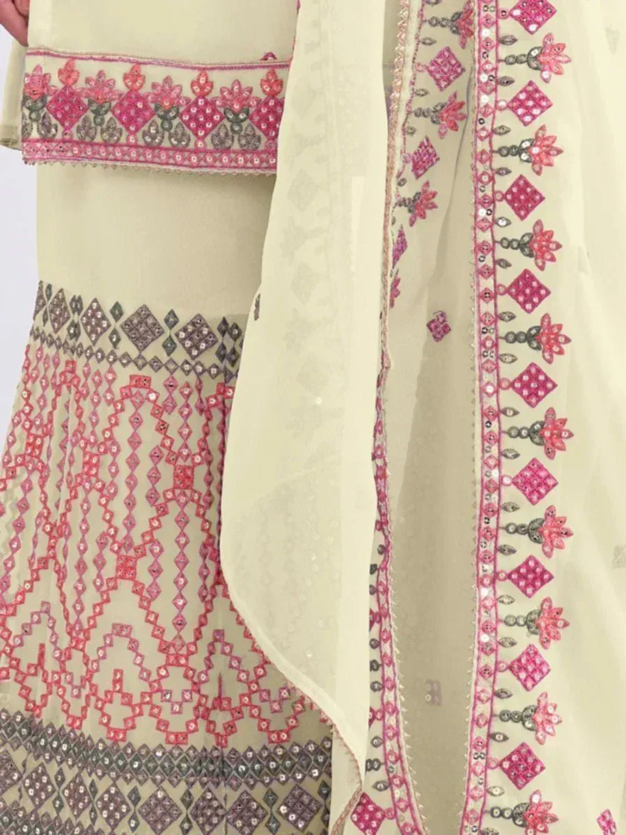 Cream embroidered lehenga choli with pink and silver mirror work, ethnic Indian wedding wear