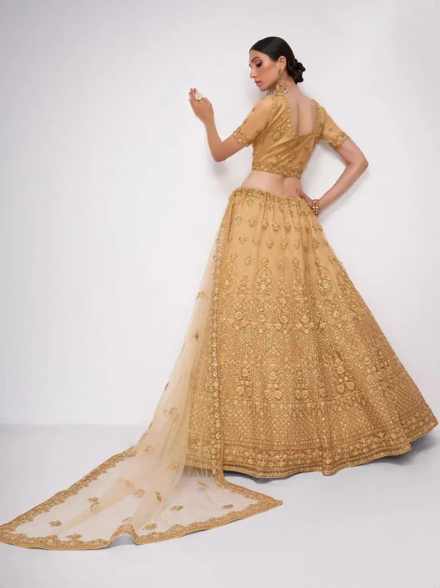 Gold embroidered lehenga choli with sheer dupatta, perfect for Indian weddings and festive occasions