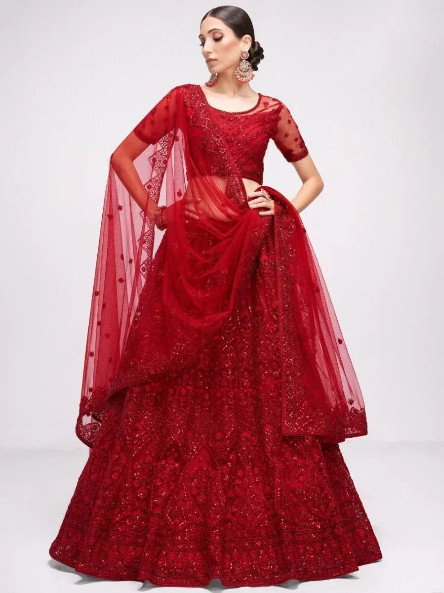 Red designer lehenga choli with heavy embroidery and sheer dupatta, perfect for weddings and festive occasions