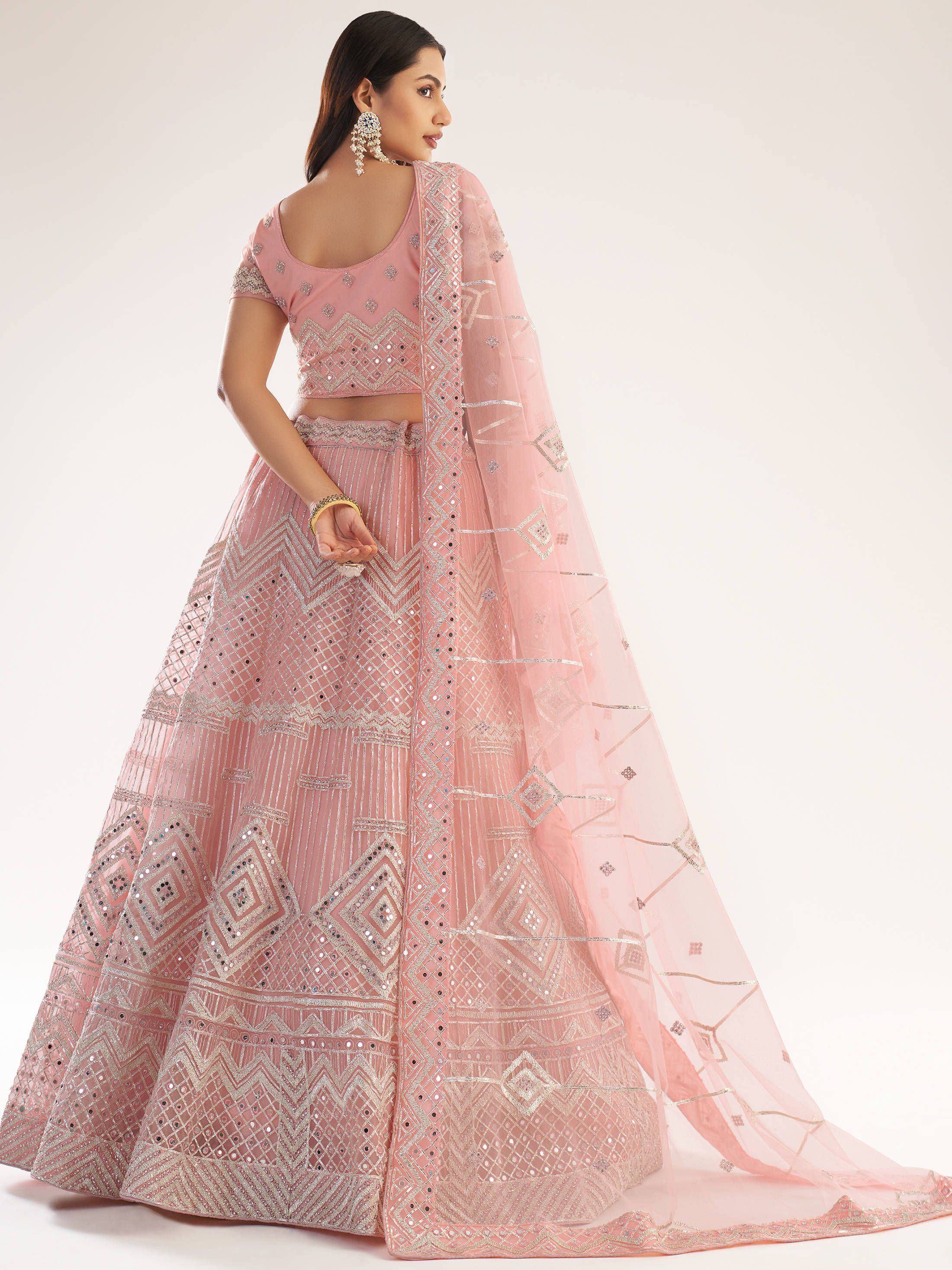 Pink designer lehenga choli with mirror work and geometric embroidery, perfect for weddings and festivals