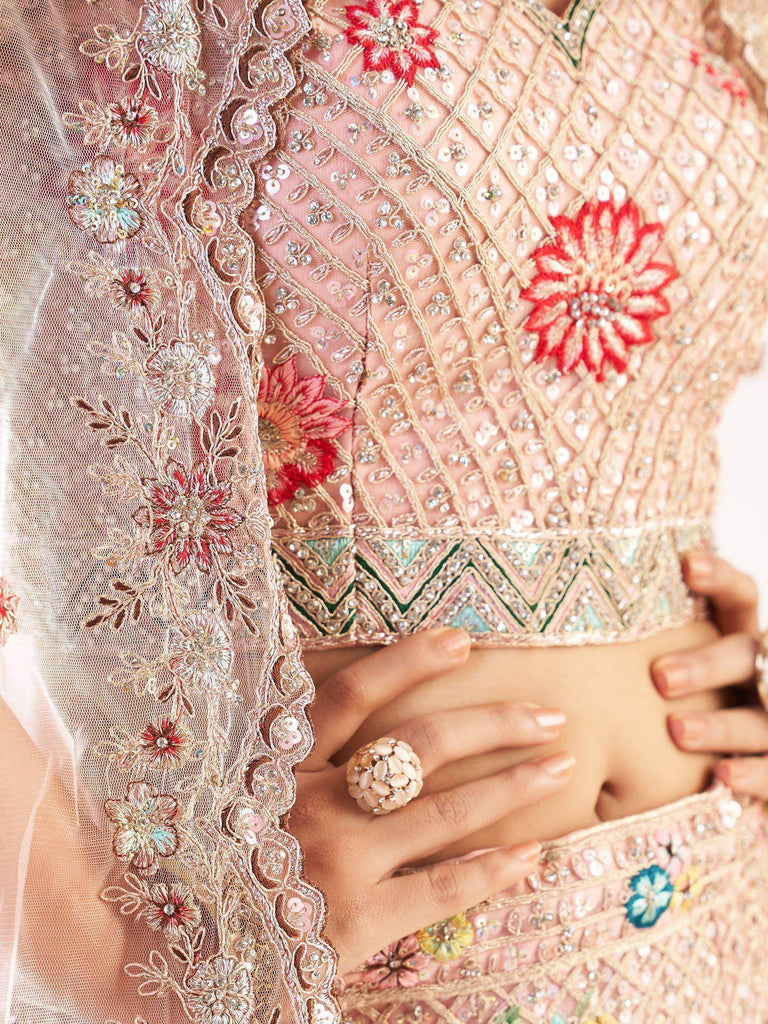 Excellent Peach Sequins Embroidered Net Wedding Wear Lehenga Choli