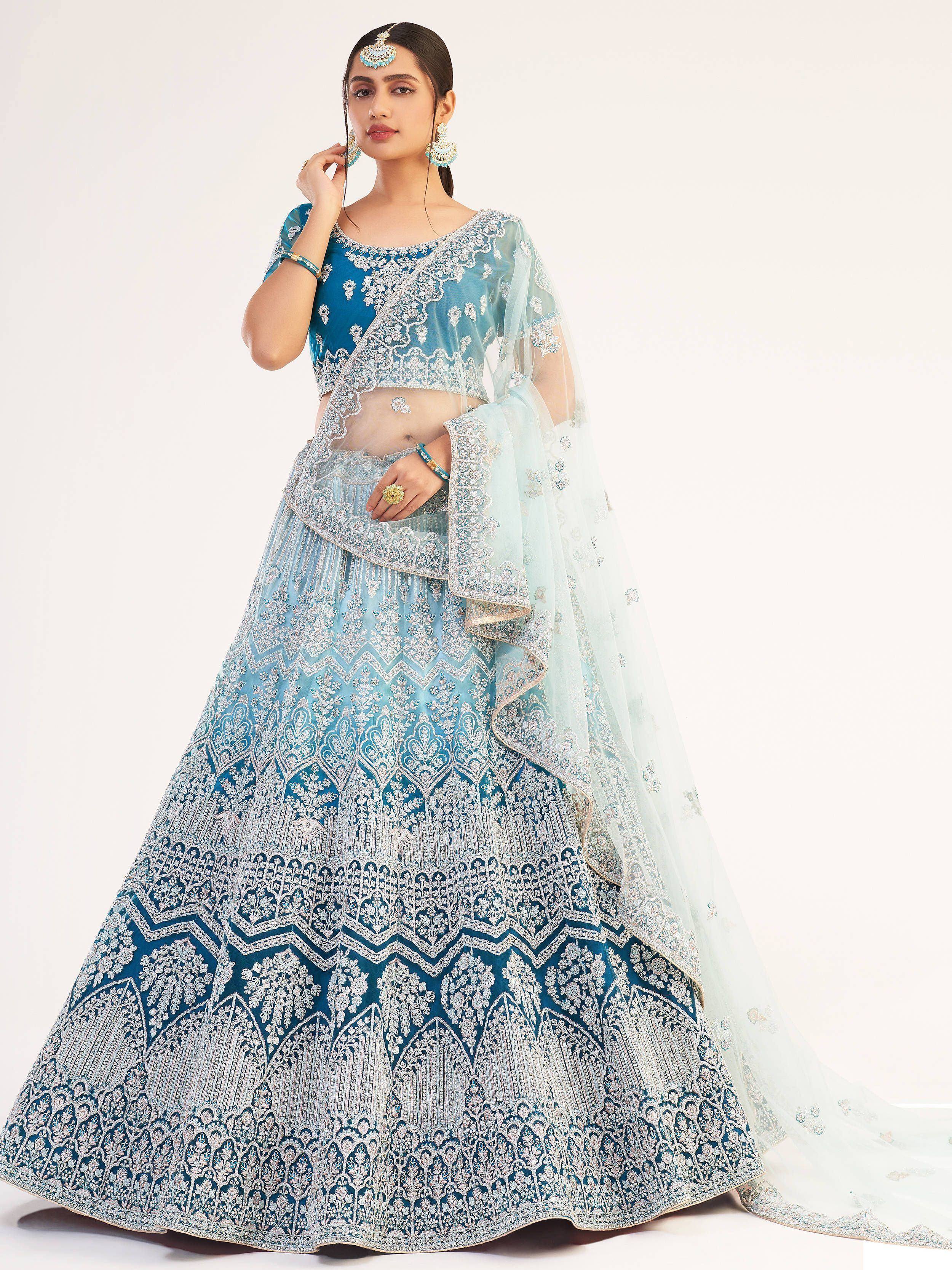 Blue designer lehenga choli with intricate silver embroidery and sheer dupatta, perfect for Indian ethnic wear