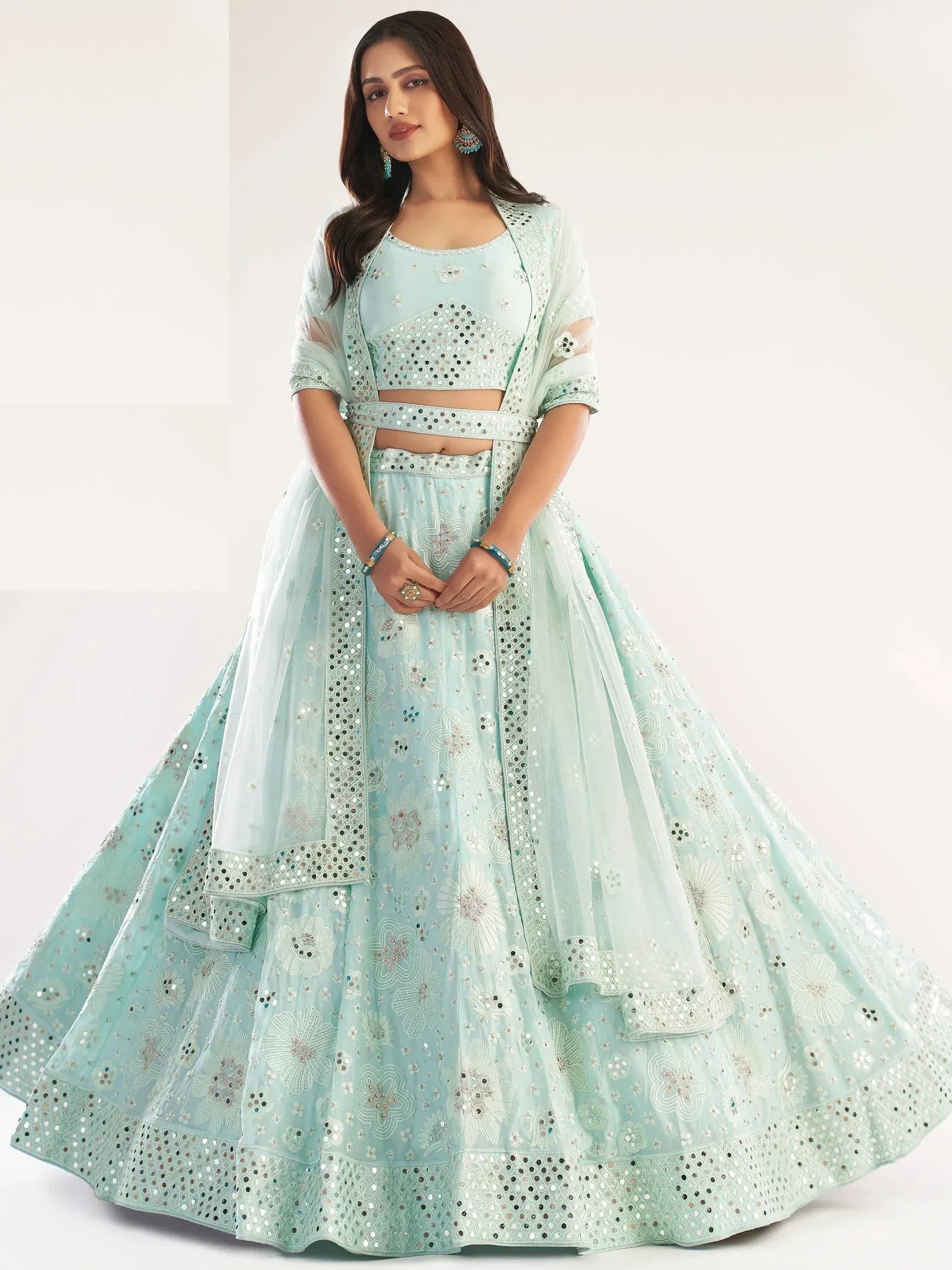 Mint green designer lehenga choli with mirror work and floral embroidery for Indian ethnic wear