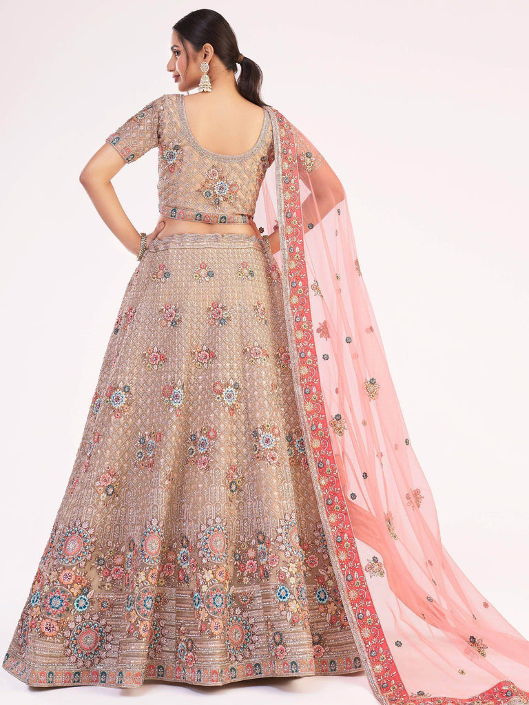 Impressive Gold Sequins Embroidered Net Wedding Wear Lehenga Choli