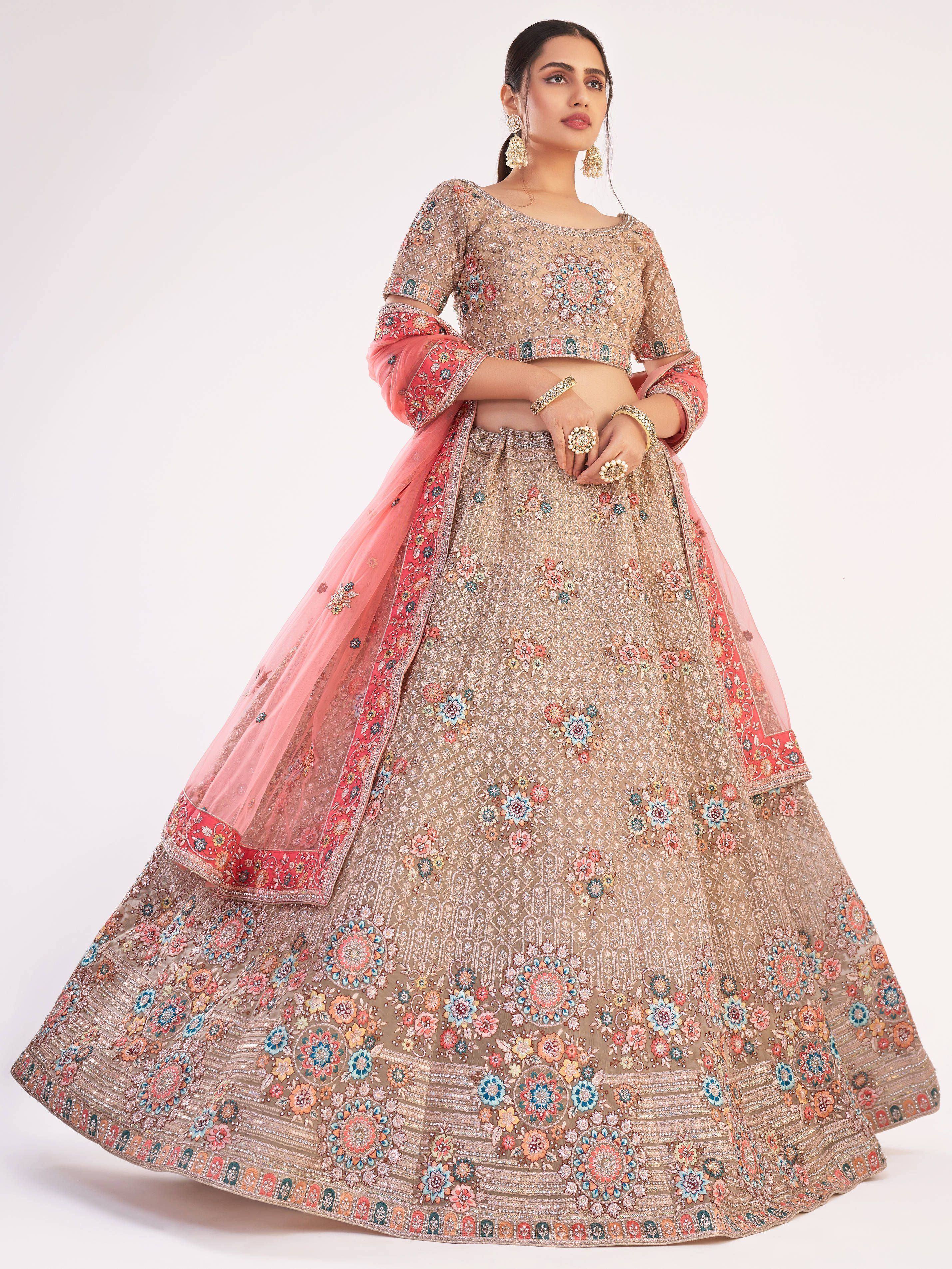 Designer lehenga choli with floral embroidery and pink dupatta, perfect for Indian weddings and festive occasions.