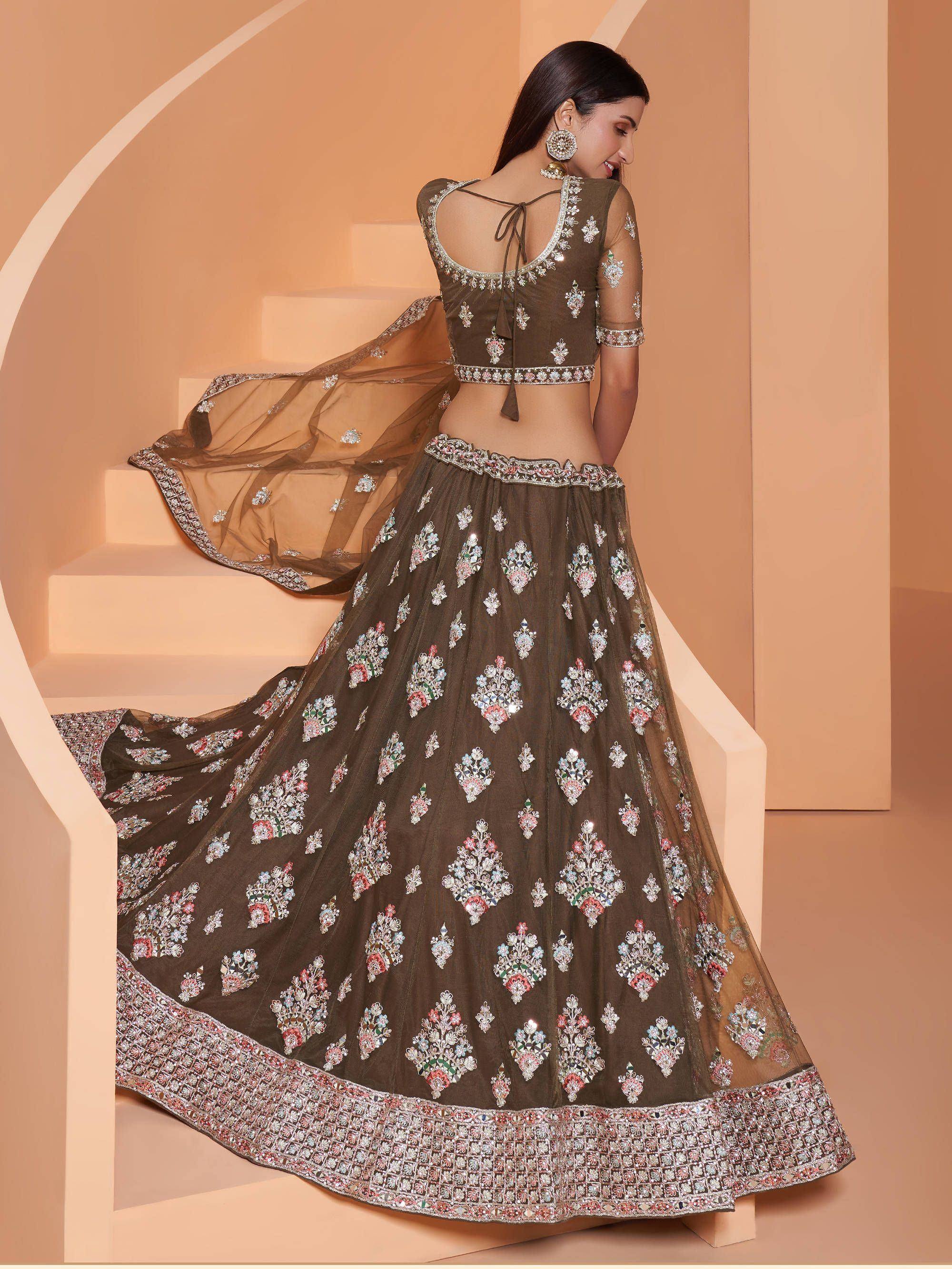 Elegant olive green lehenga choli with floral embroidery and mirror work, perfect for Indian ethnic occasions.