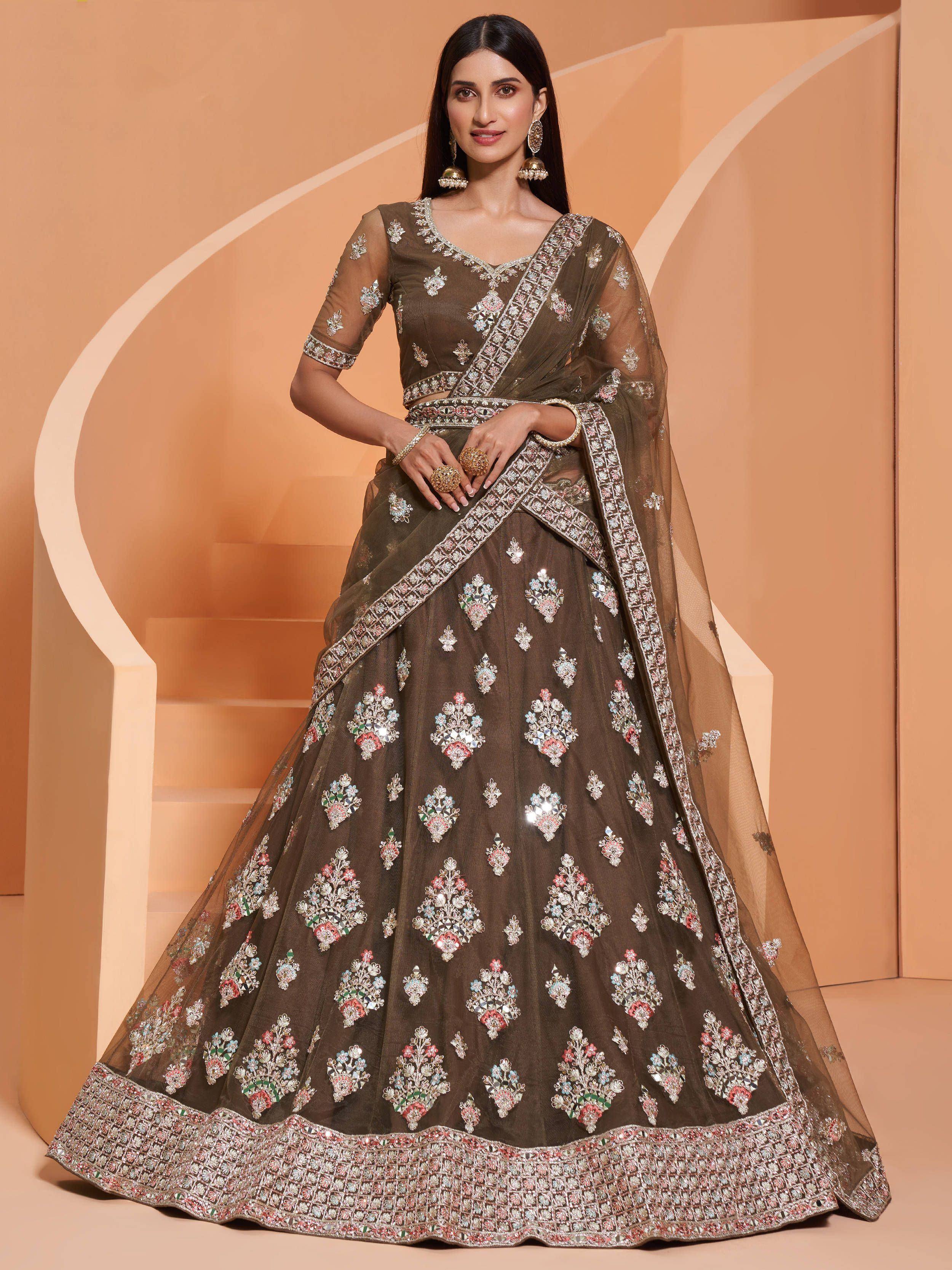 Elegant brown lehenga choli with floral mirror work, perfect for Indian weddings and festive occasions.