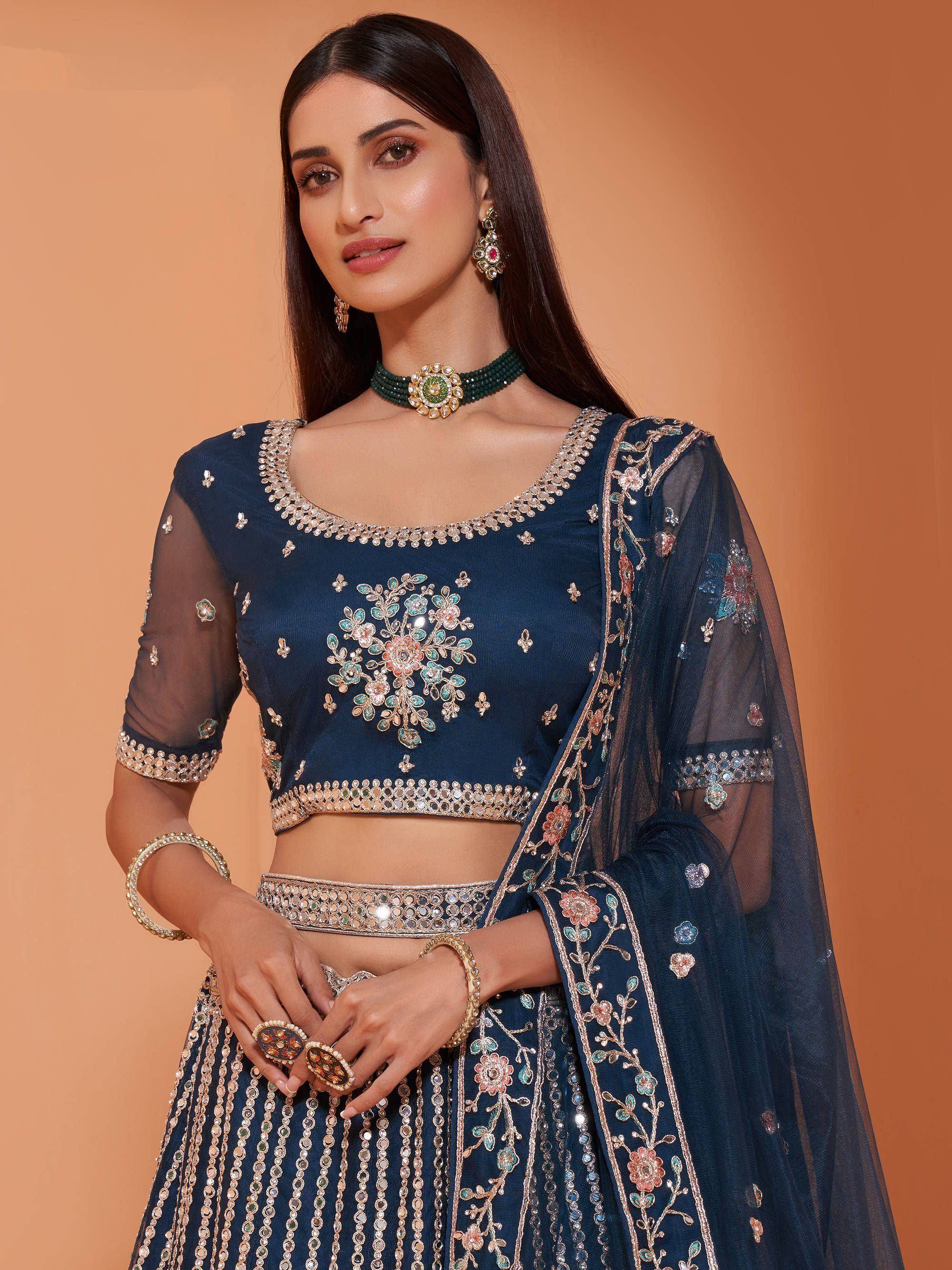 Navy blue embroidered lehenga choli with floral mirror work and sheer dupatta, perfect for Indian ethnic occasions