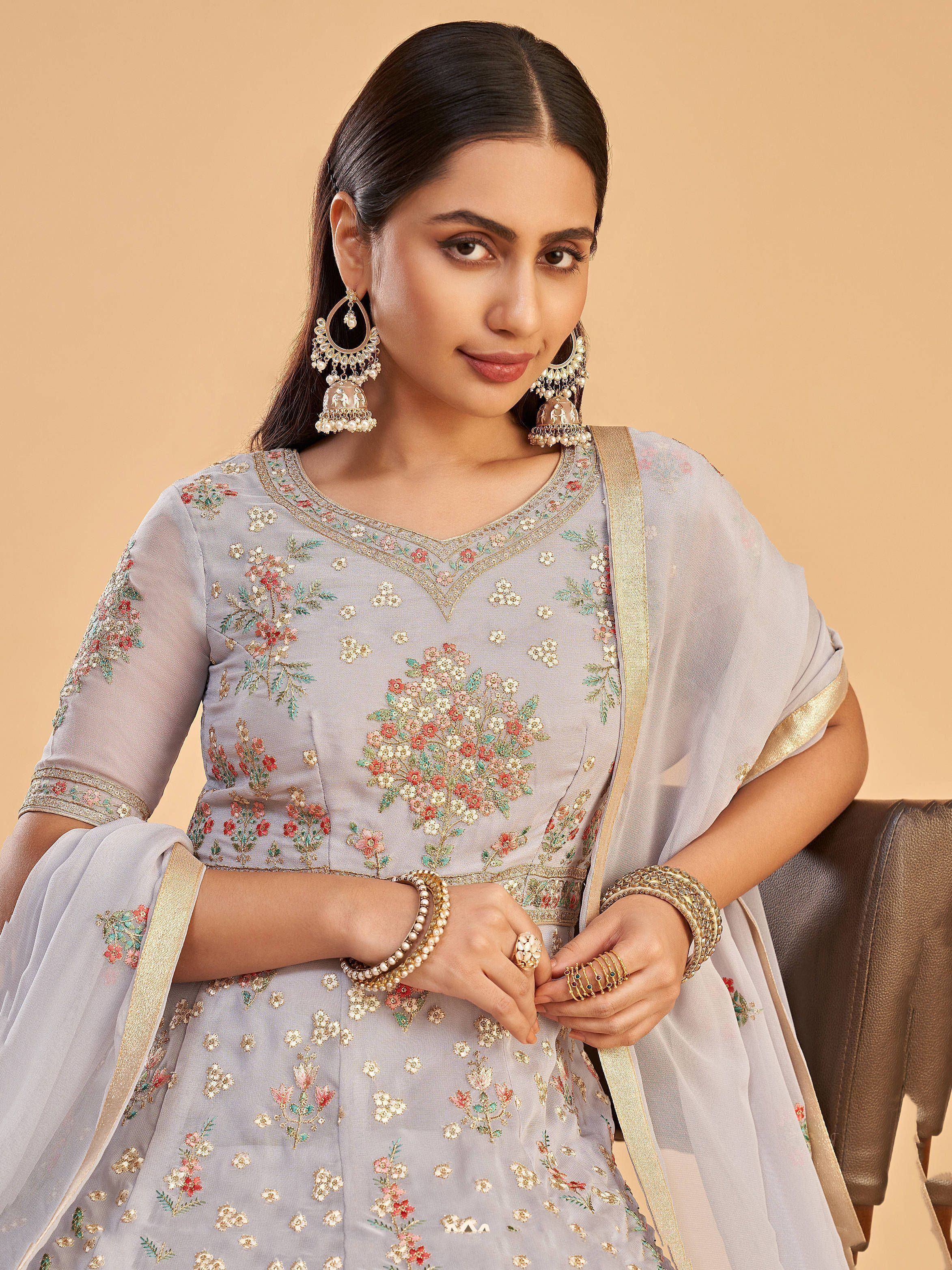Elegant grey floral embroidered salwar kameez with gold trim and jhumka earrings