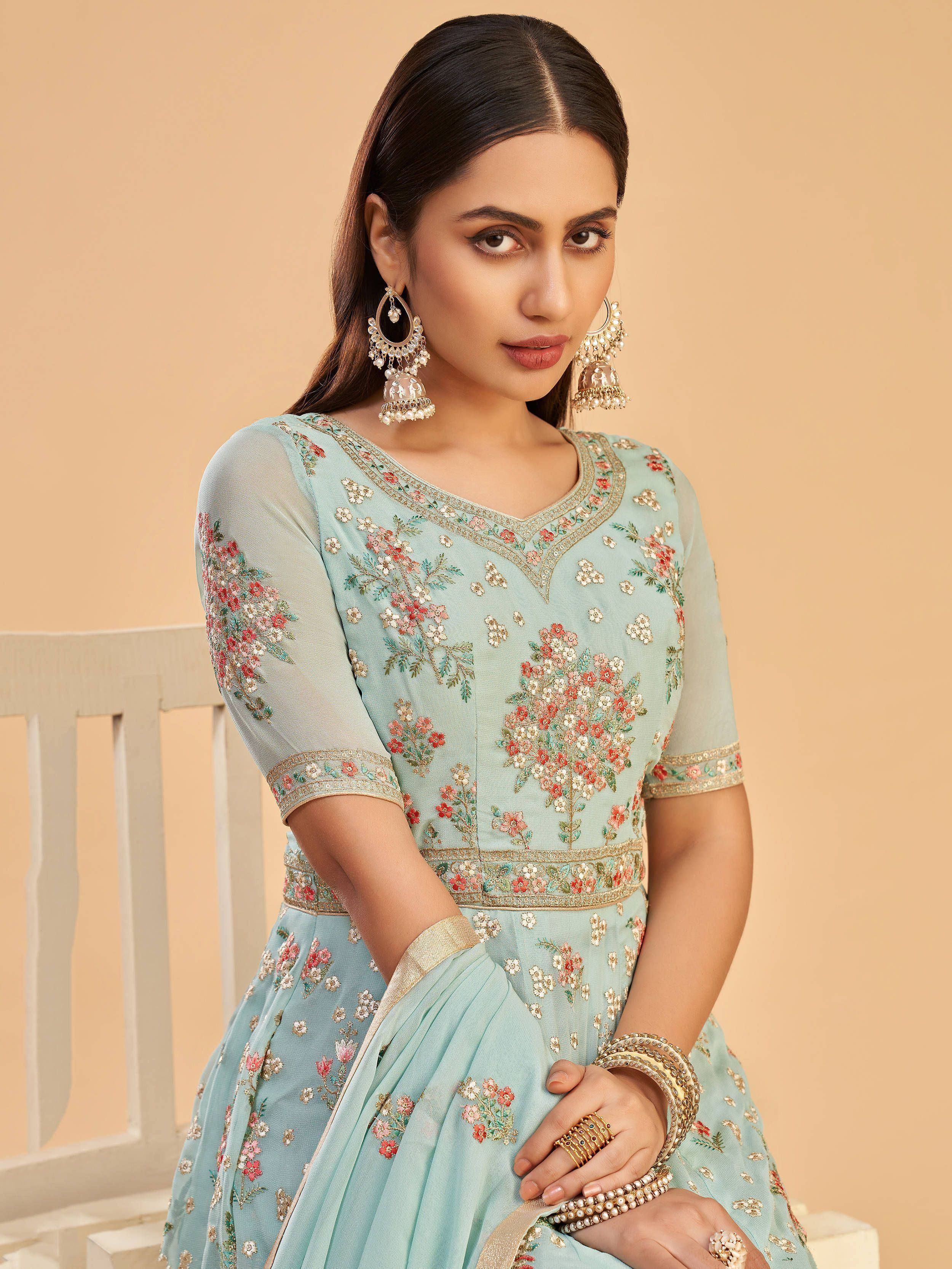 Mint green embroidered lehenga choli with floral motifs, perfect for Indian ethnic wear and festive occasions.