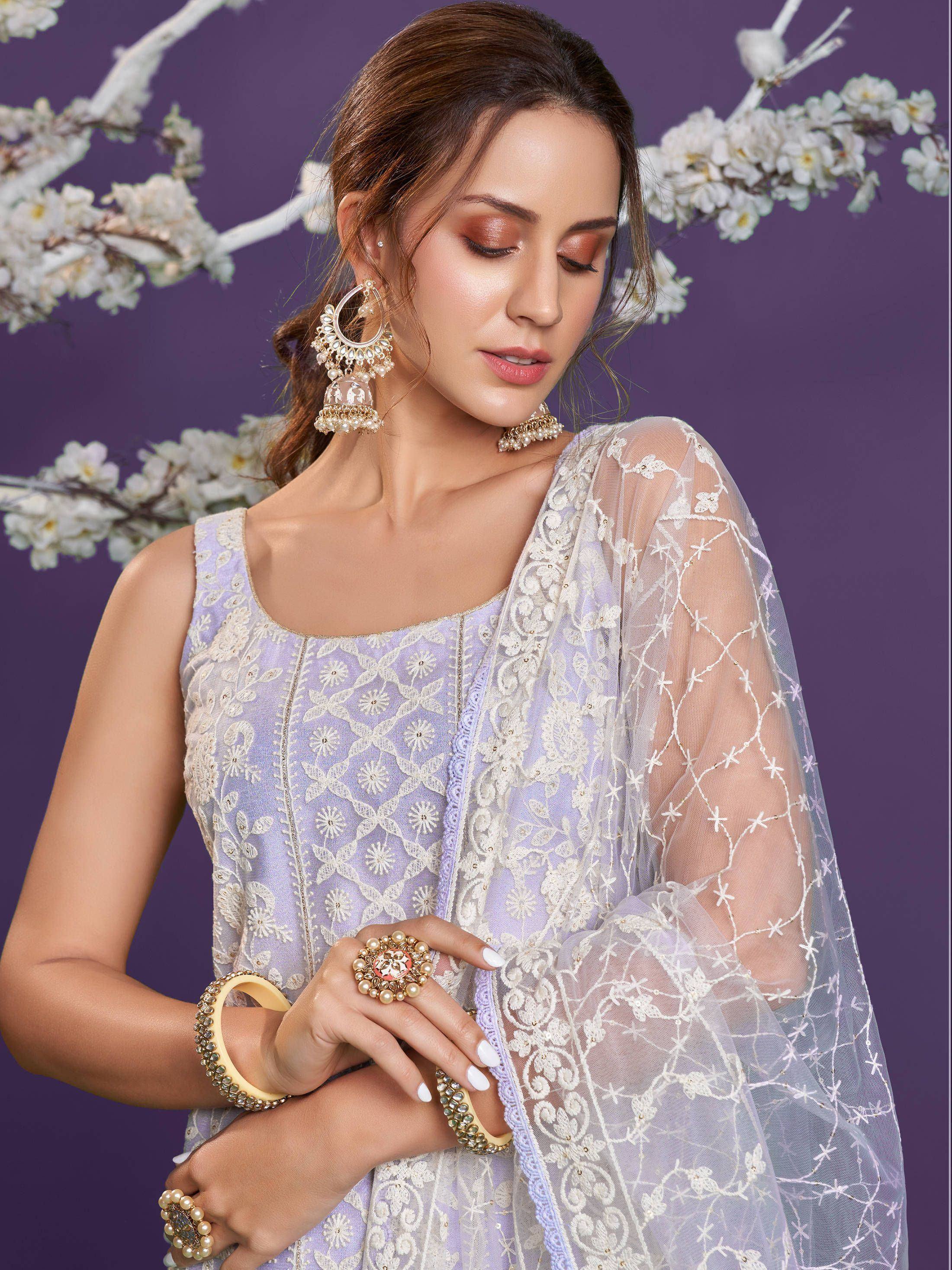Lavender embroidered ethnic gown with sheer dupatta, perfect for Indian weddings and festive occasions.
