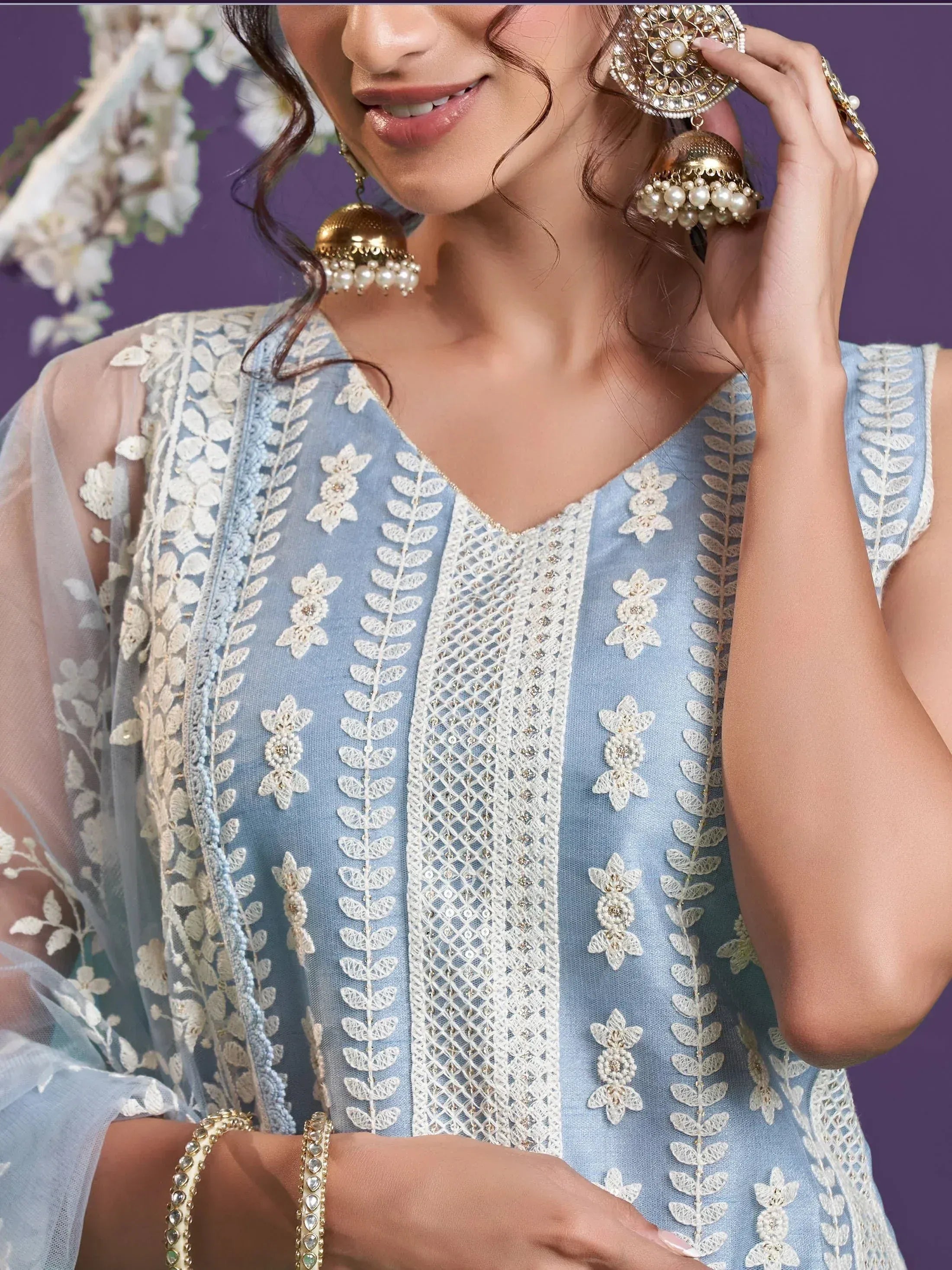Light blue embroidered ethnic kurti with floral lace and pearl jhumka earrings