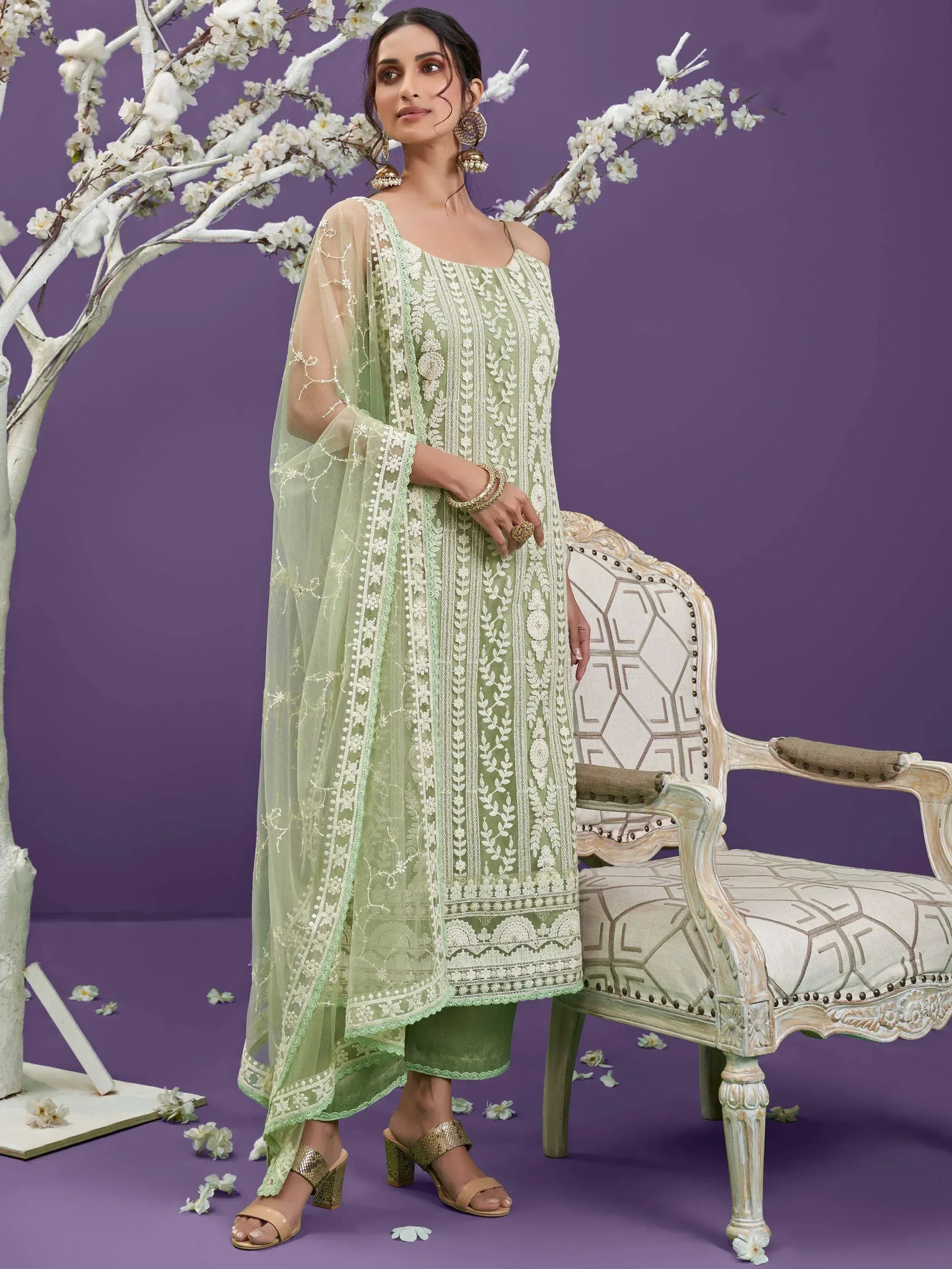 Elegant mint green embroidered salwar kameez with floral dupatta, perfect for ethnic occasions.