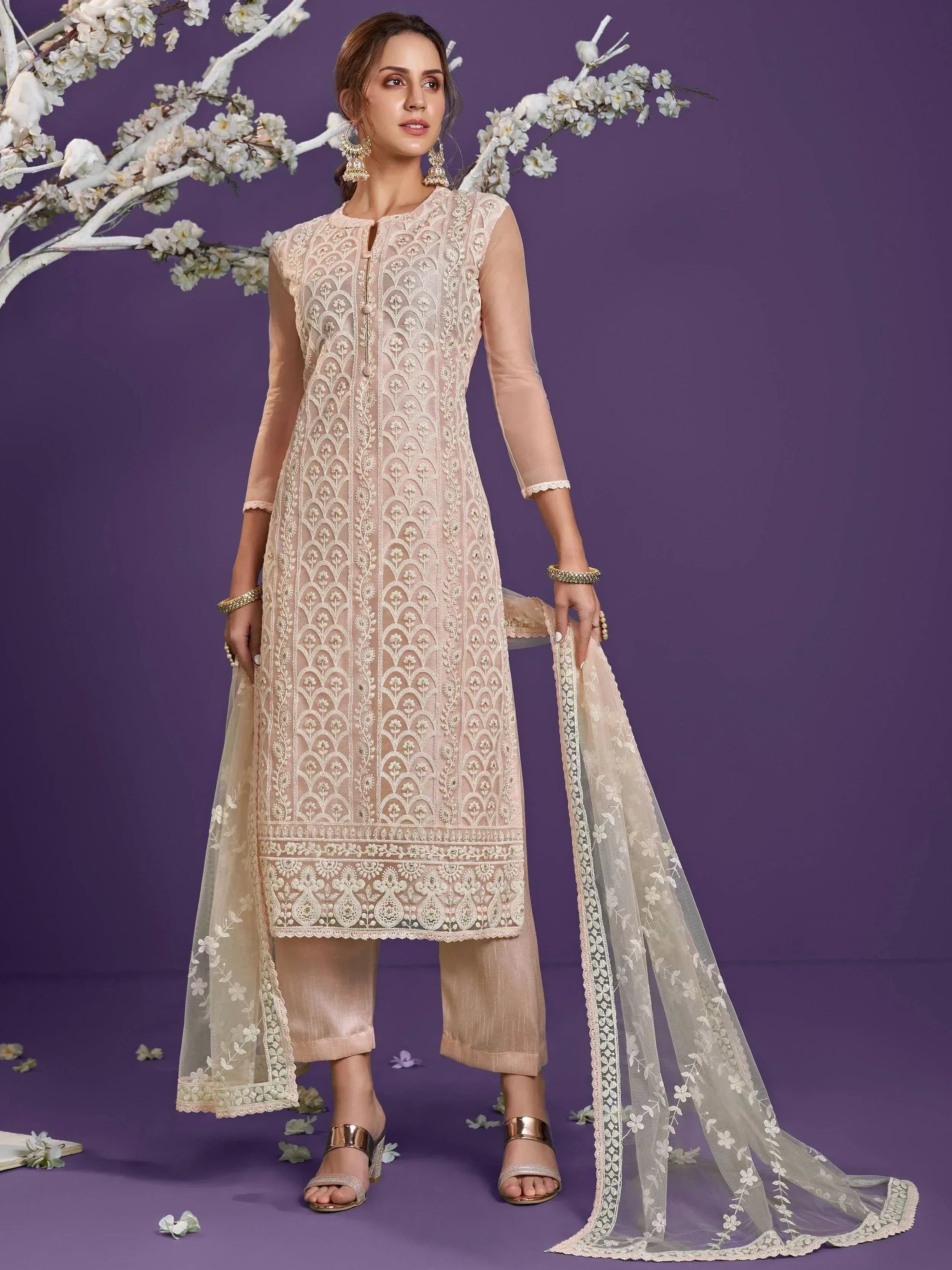Elegant beige embroidered salwar kameez with sheer dupatta, perfect for Indian ethnic wear occasions.