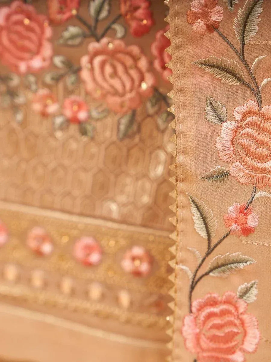 Pink floral embroidery on ethnic wear fabric, detailed rose patterns with gold accents