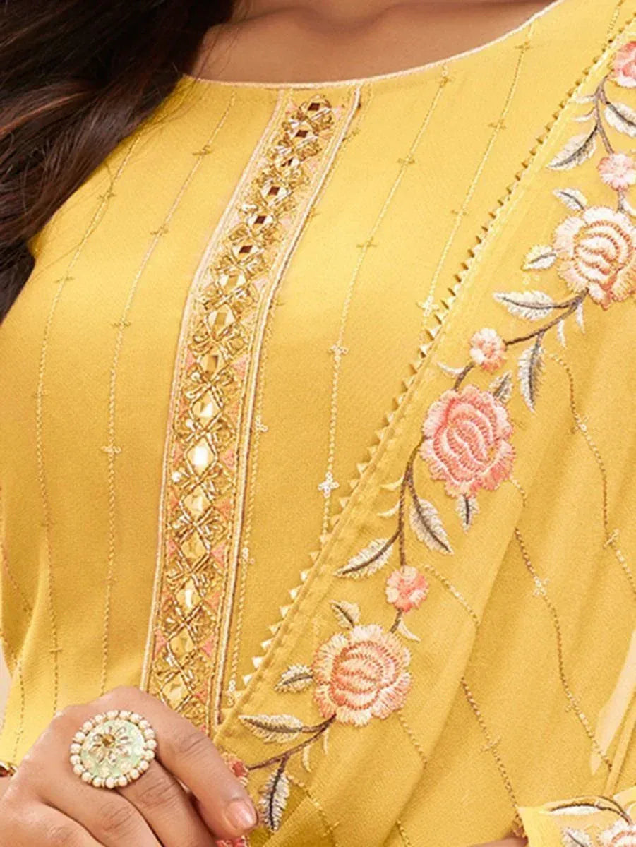 Yellow ethnic kurti with floral embroidery and gold detailing, perfect for Indian wear