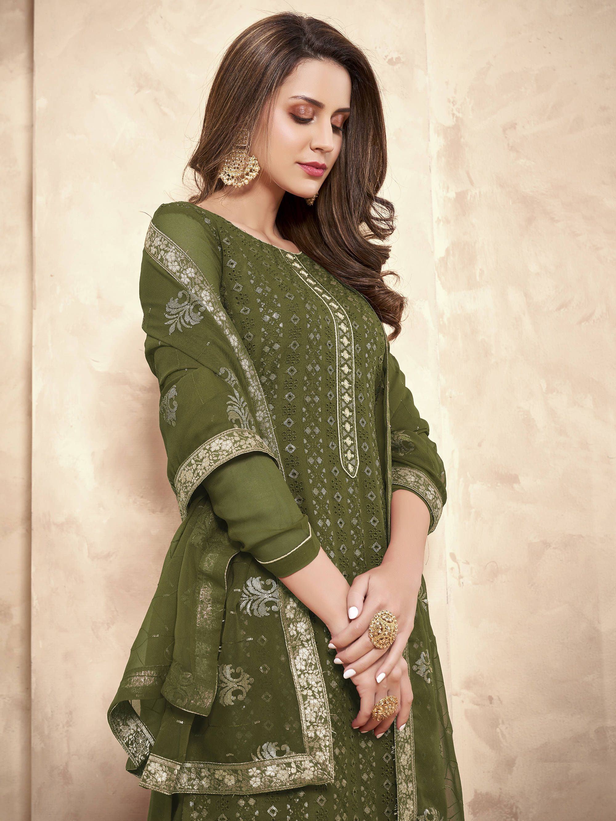 Woman in olive green embroidered salwar kameez with dupatta and gold jewelry