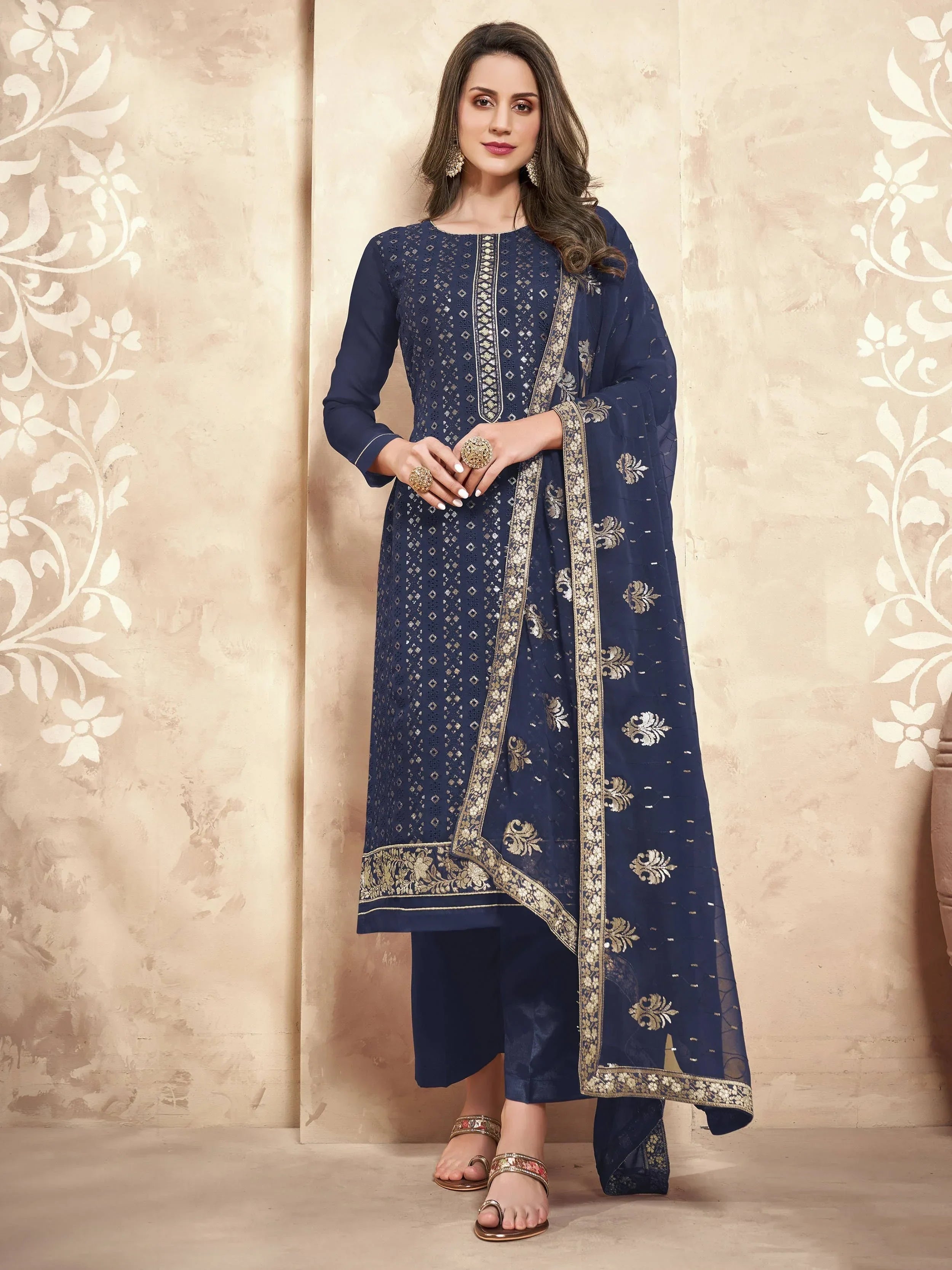 Woman in navy blue embroidered salwar kameez with dupatta, ethnic Indian wear