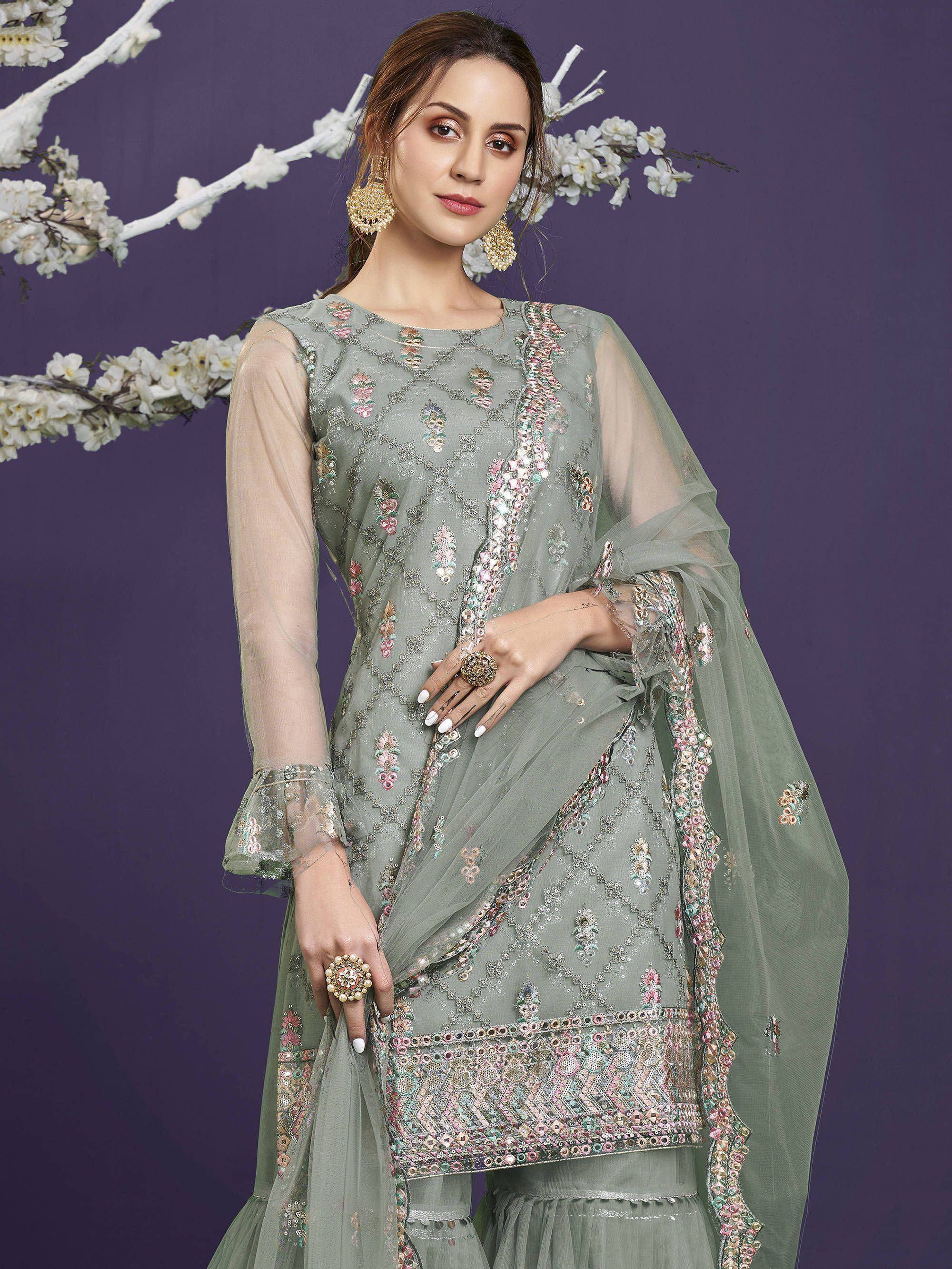 Elegant green embroidered salwar kameez with floral detailing and sheer dupatta, perfect for ethnic occasions.