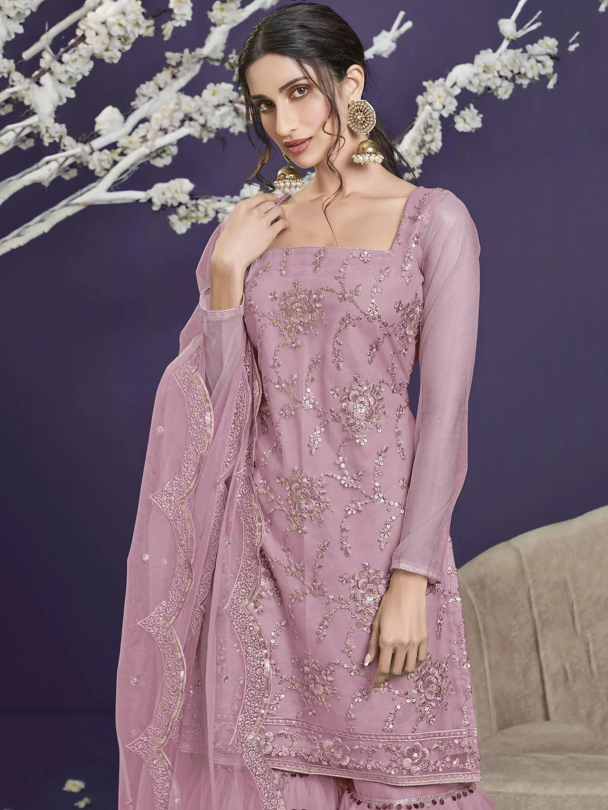 Elegant mauve salwar kameez with intricate floral embroidery and matching dupatta, perfect for festive occasions.
