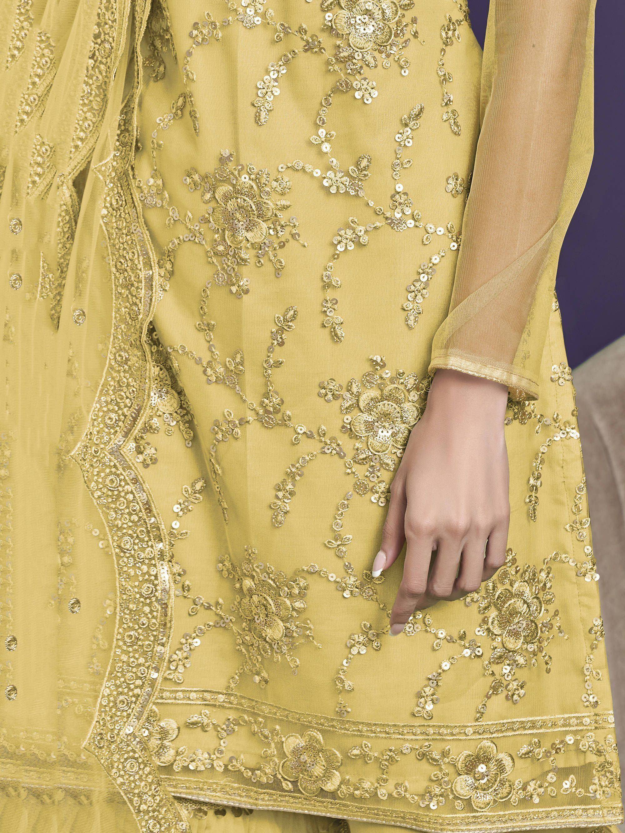 Elegant yellow ethnic gown with intricate gold floral embroidery and sequin detailing