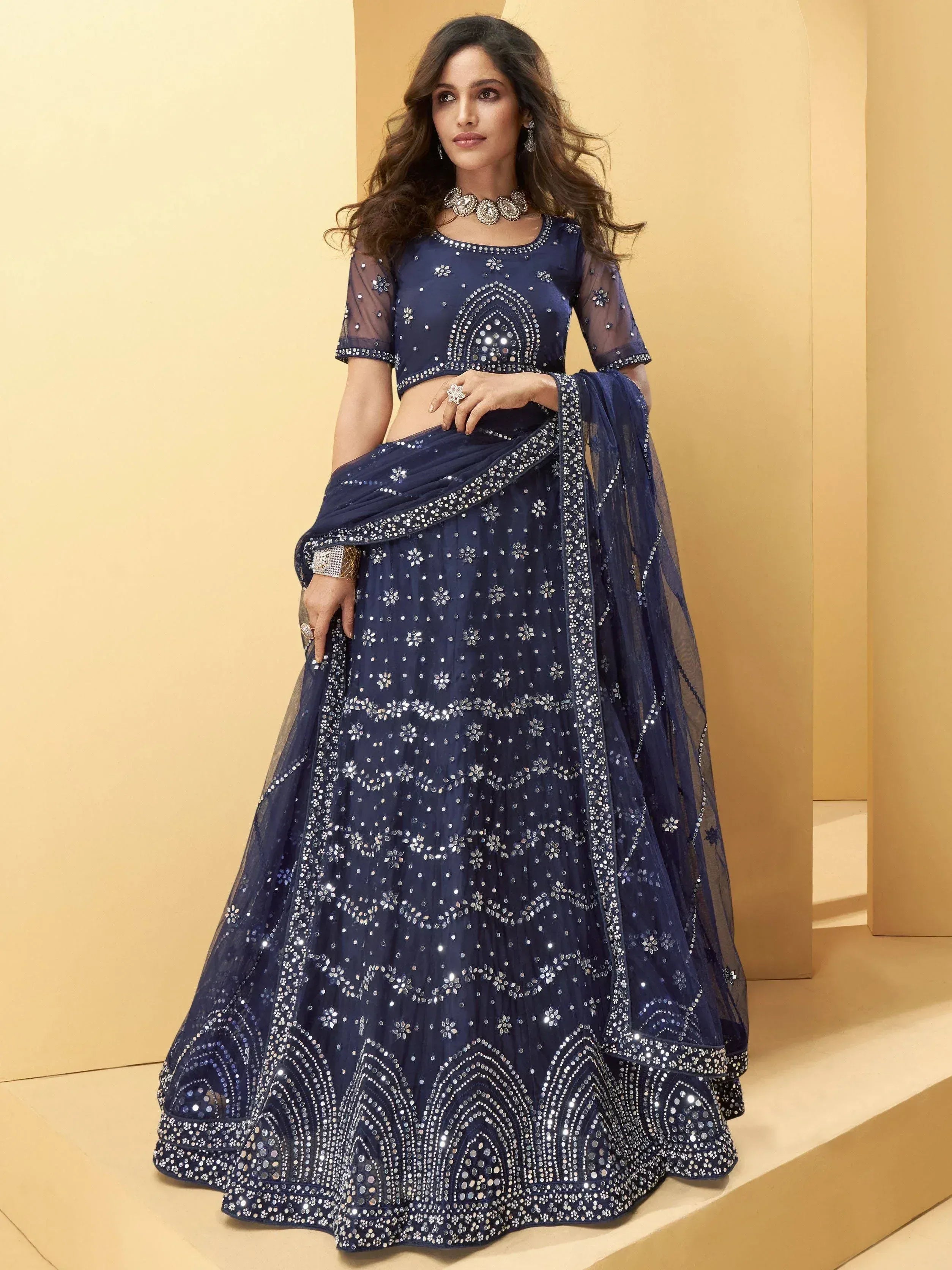Navy blue designer lehenga choli with heavy mirror and sequin work, perfect for weddings and parties