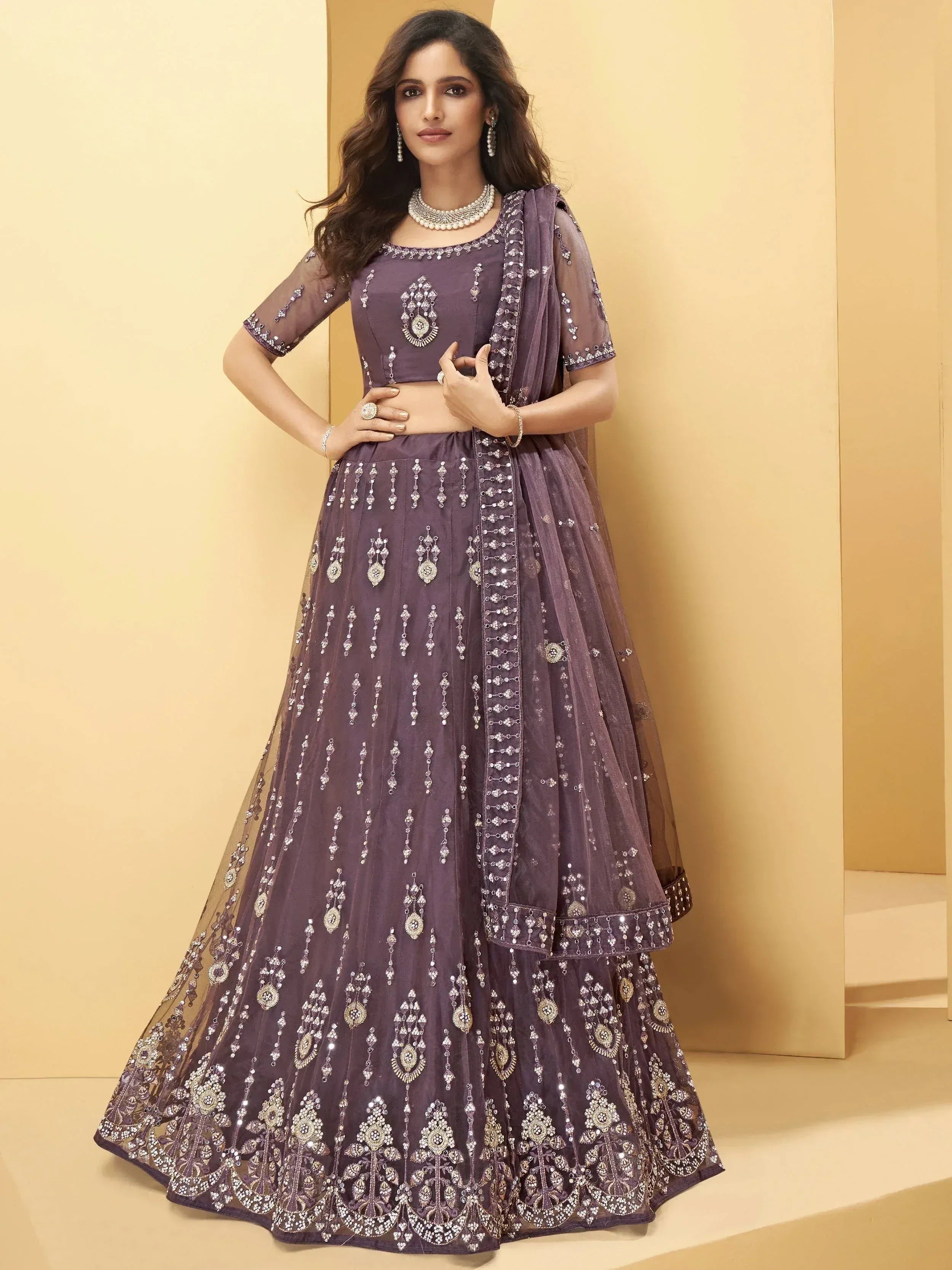 Purple embroidered lehenga choli with sheer dupatta, perfect for Indian weddings and festive occasions