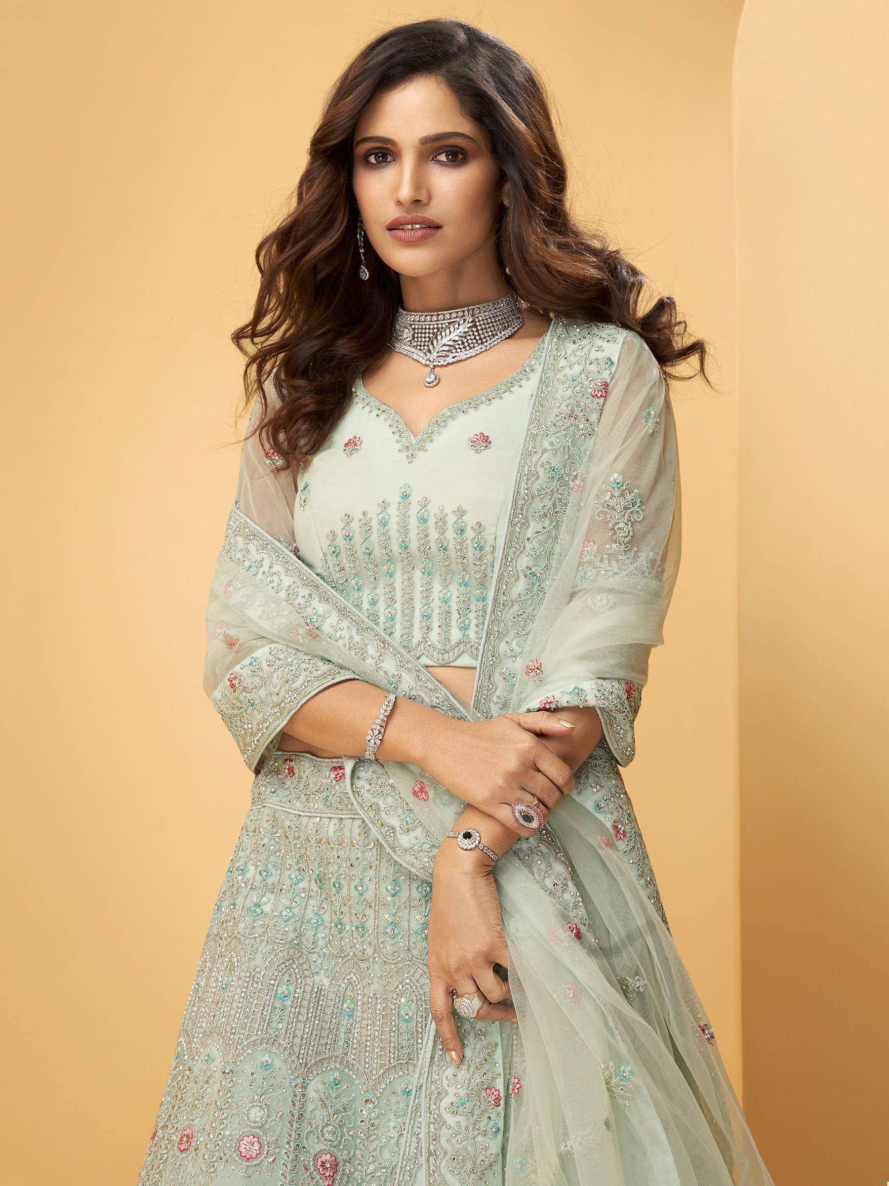 Mint green embroidered lehenga choli with sheer dupatta, perfect for Indian ethnic wear occasions