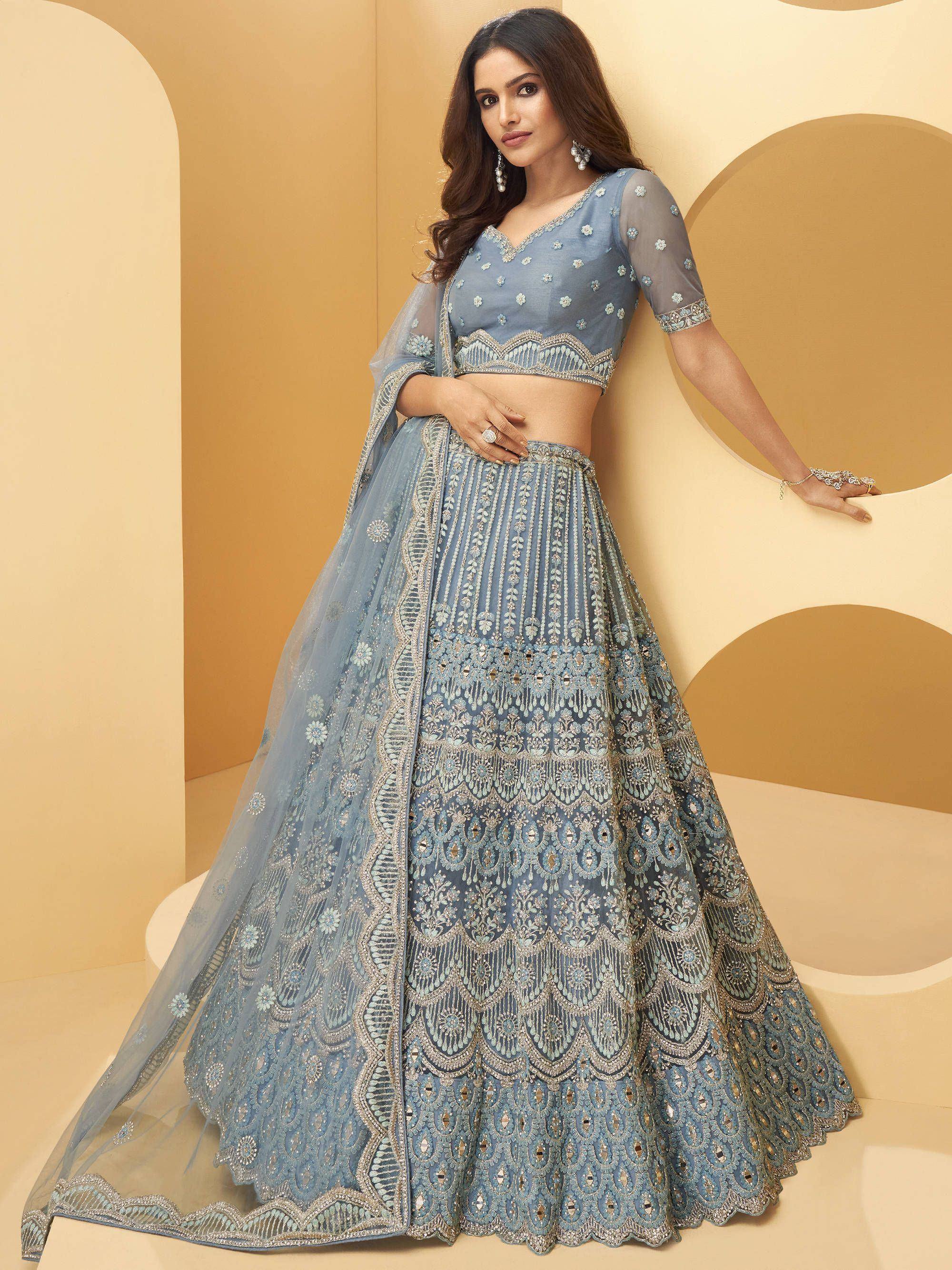 Elegant blue embroidered lehenga choli with intricate detailing and sheer dupatta for Indian ethnic wear