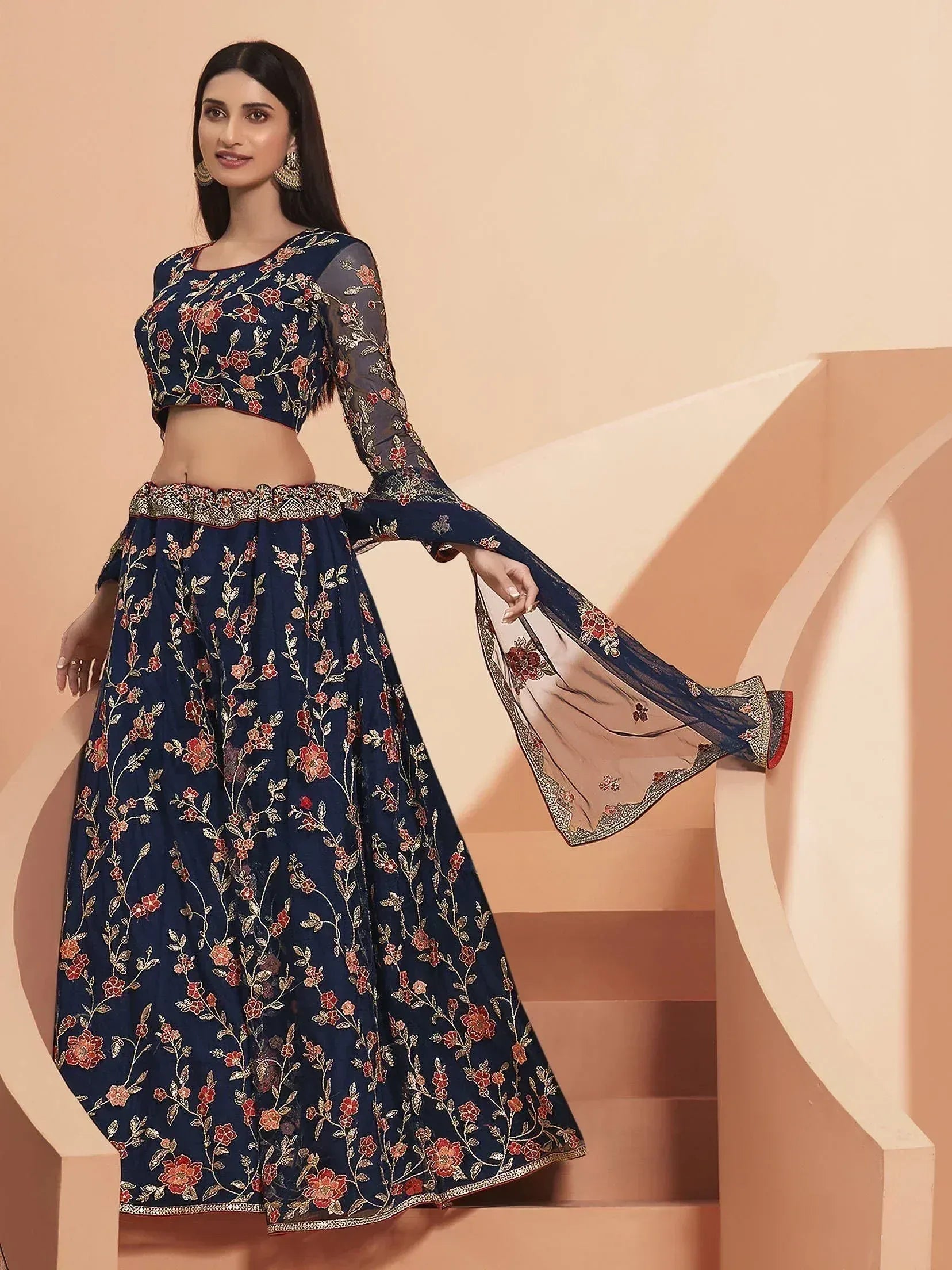Navy blue floral embroidered lehenga choli with sheer bell sleeves, perfect for Indian ethnic occasions.