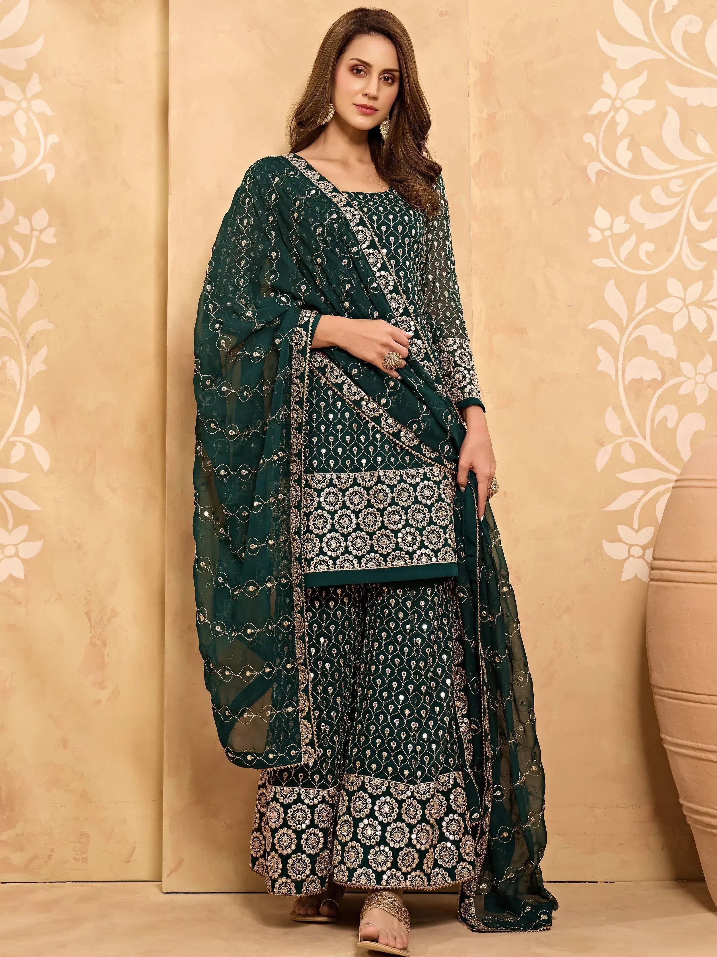 Woman in dark green embroidered salwar kameez with dupatta, ethnic wear fashion