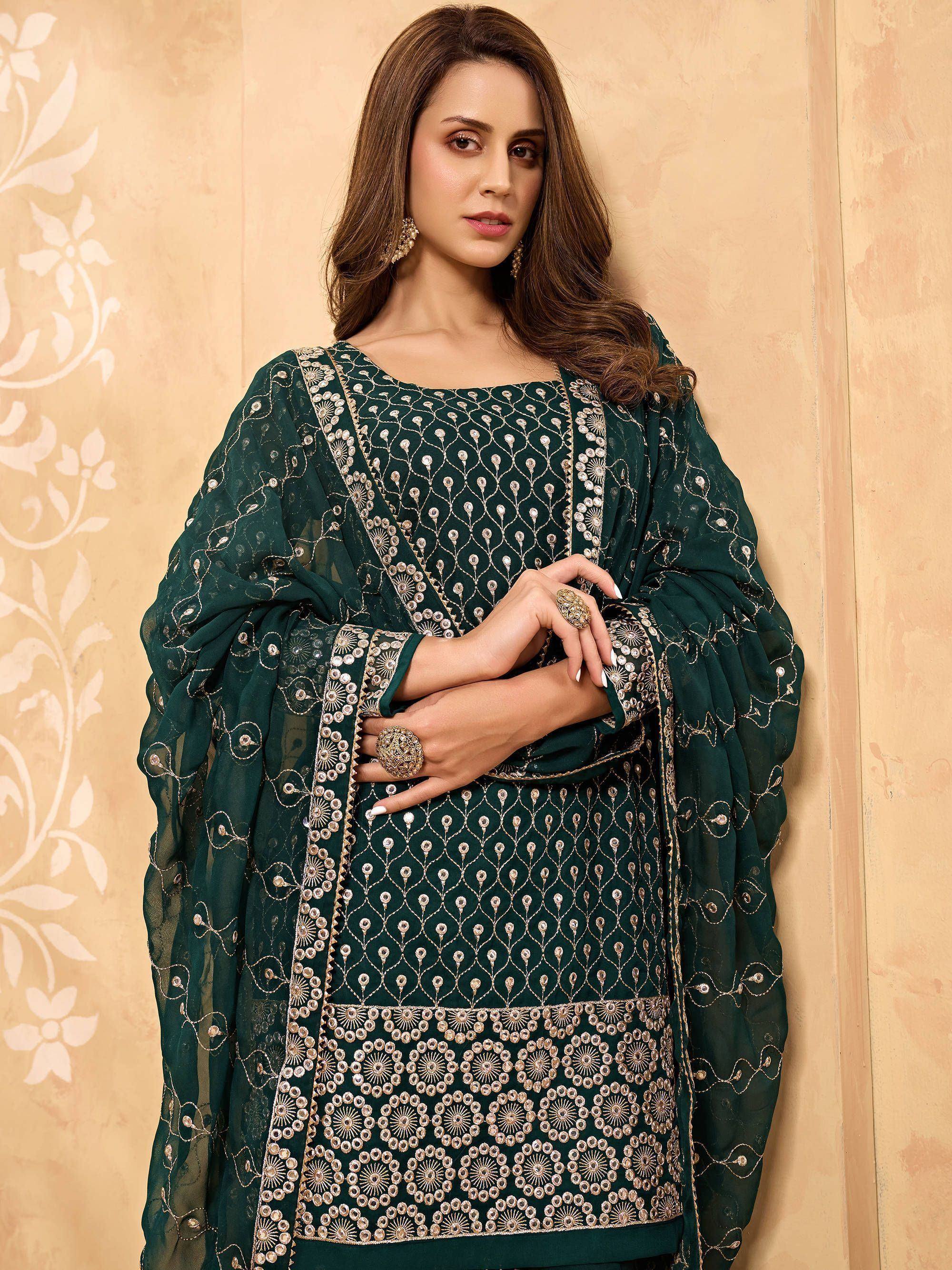 Woman wearing dark green embroidered salwar kameez with matching dupatta, ethnic wear
