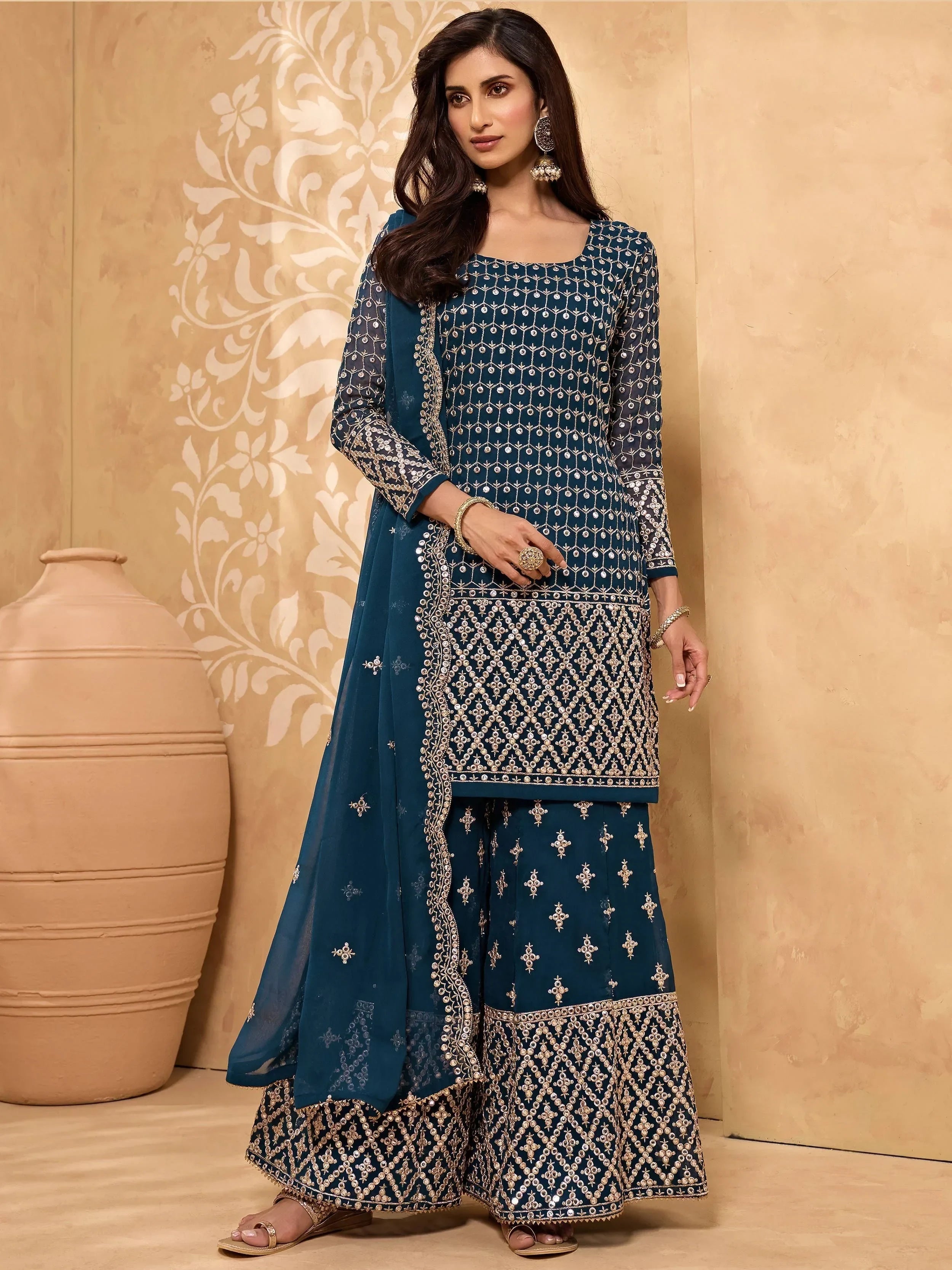 Woman in navy blue embroidered palazzo suit with dupatta, traditional Indian ethnic wear