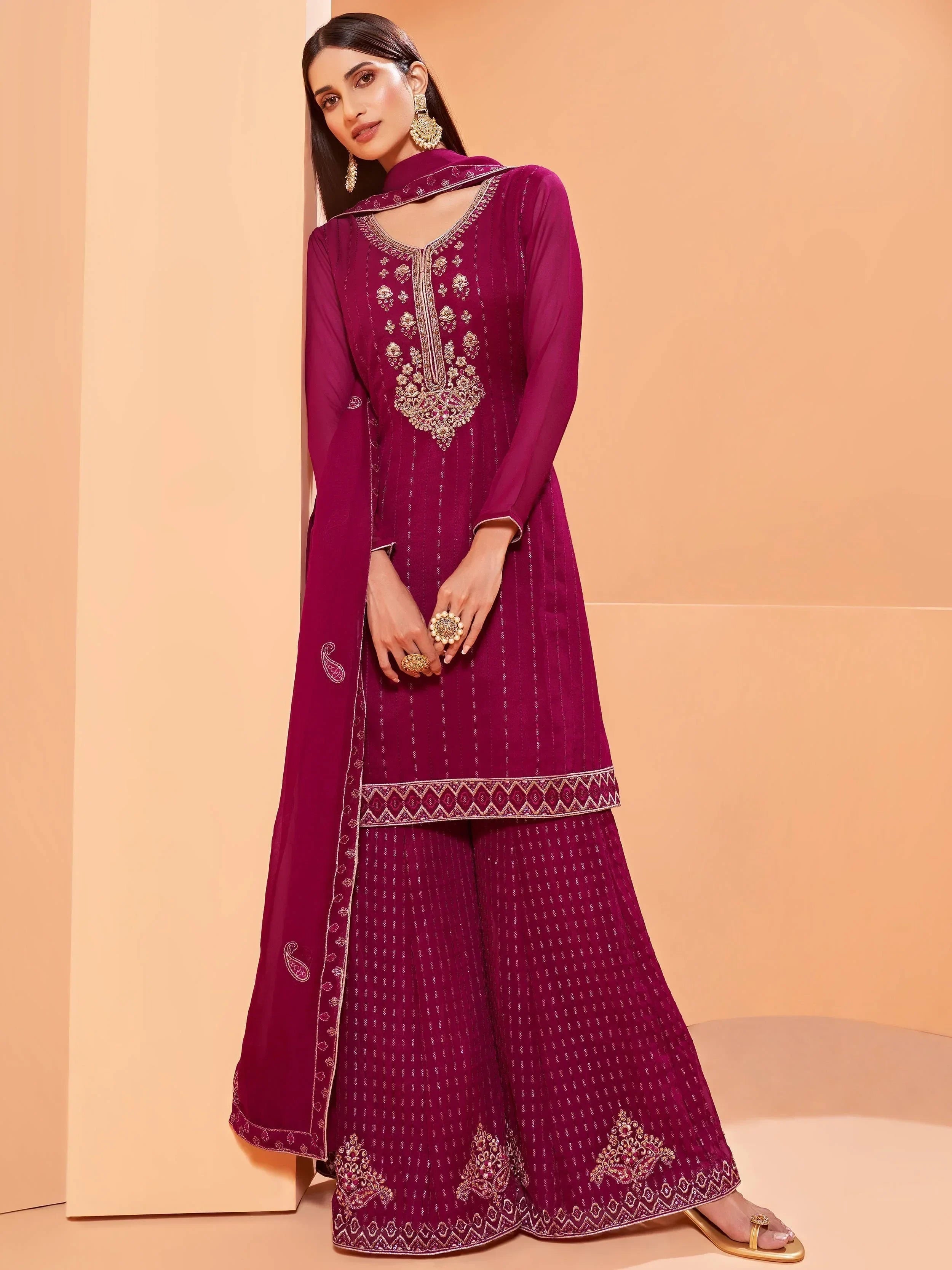 Woman in magenta embroidered salwar kameez with dupatta, Indian ethnic outfit
